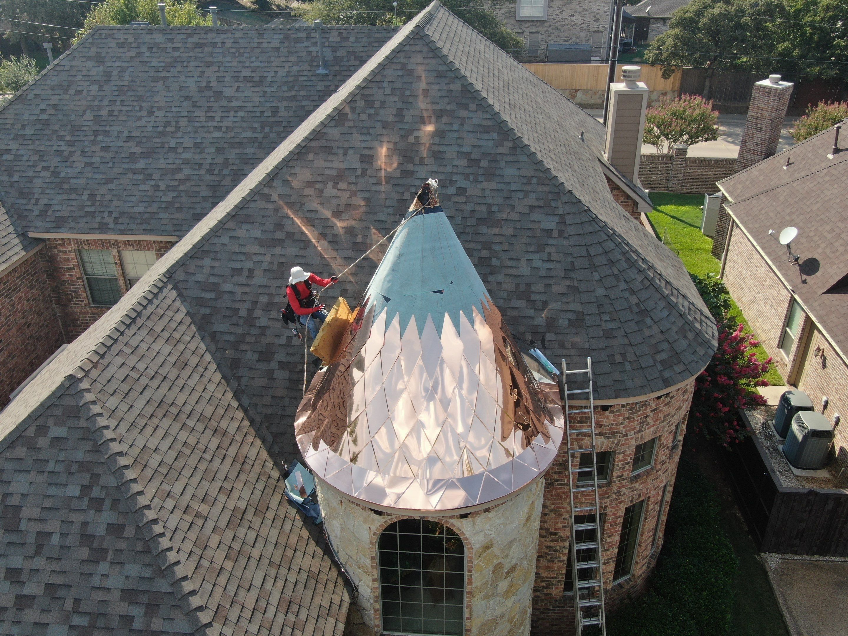 Installing Custom copper turret and Malarkey Vista Class 4 shingles Hail Damage Upgrade by Becker Roofing and Exteriors