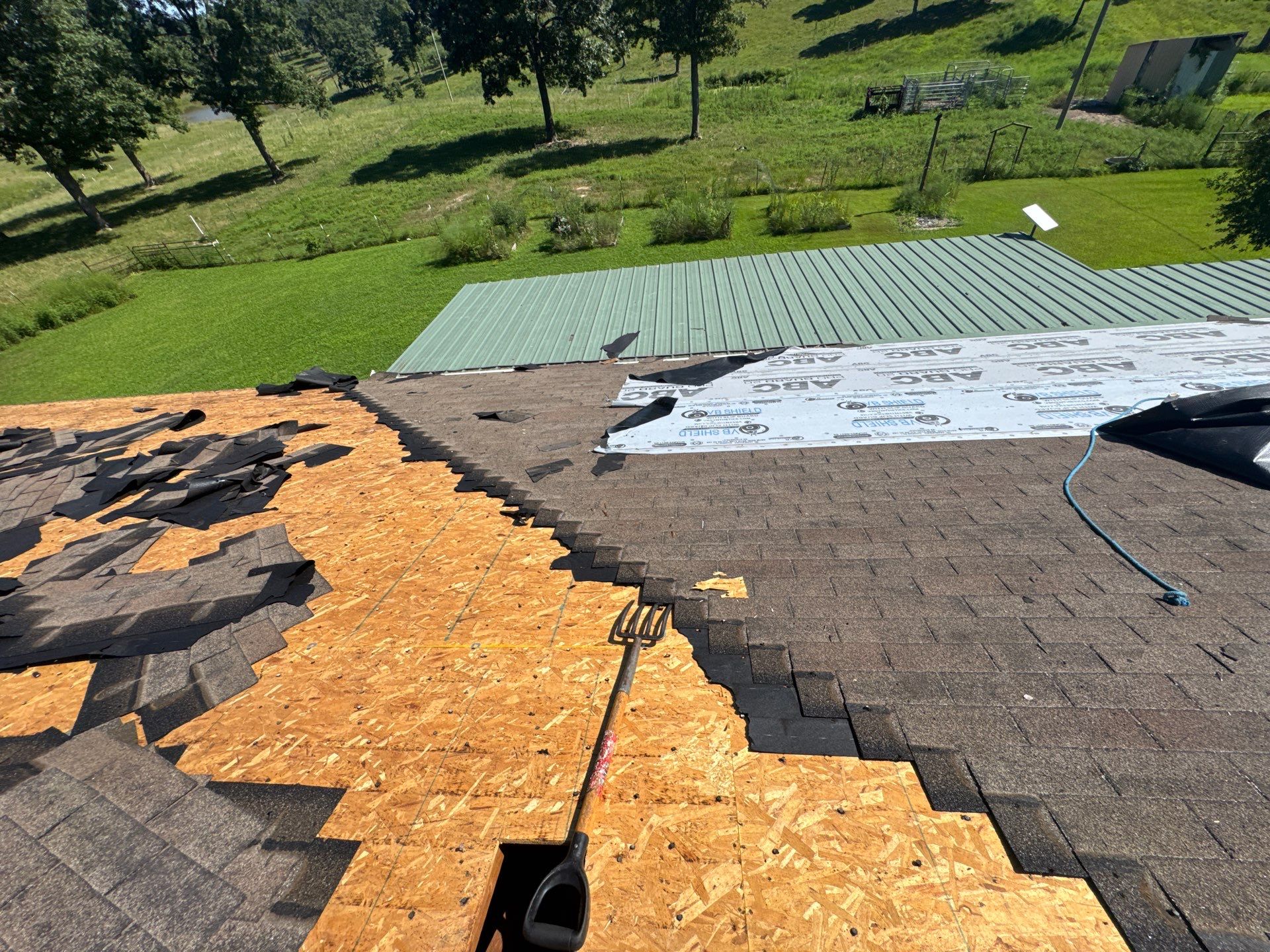 Residential Roof + Gutters & Downspouts & Gutter Covers Install  by Titan Commercial & Residential Roofing 