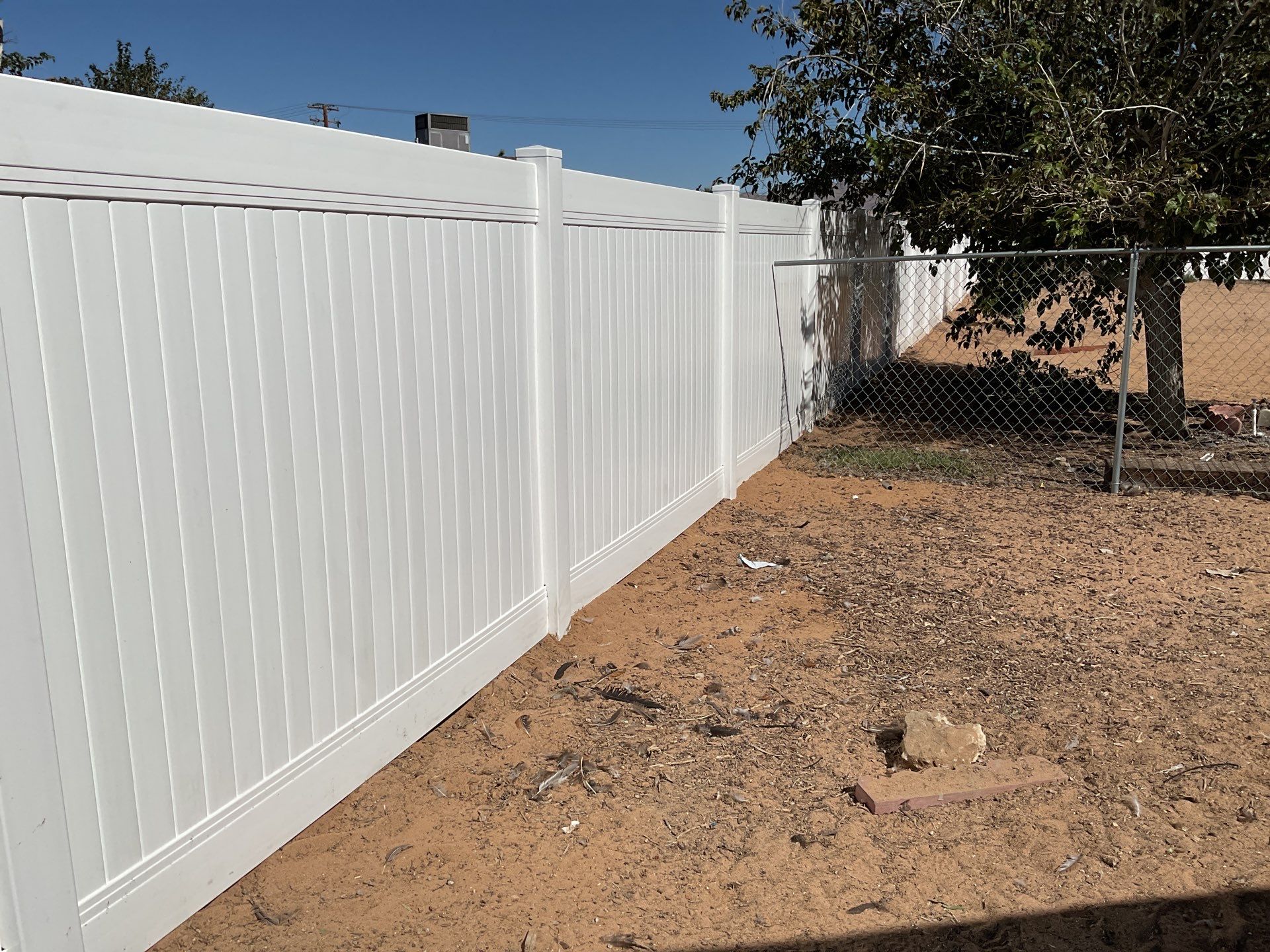 White picket fence  by Fence Guys Inc. 