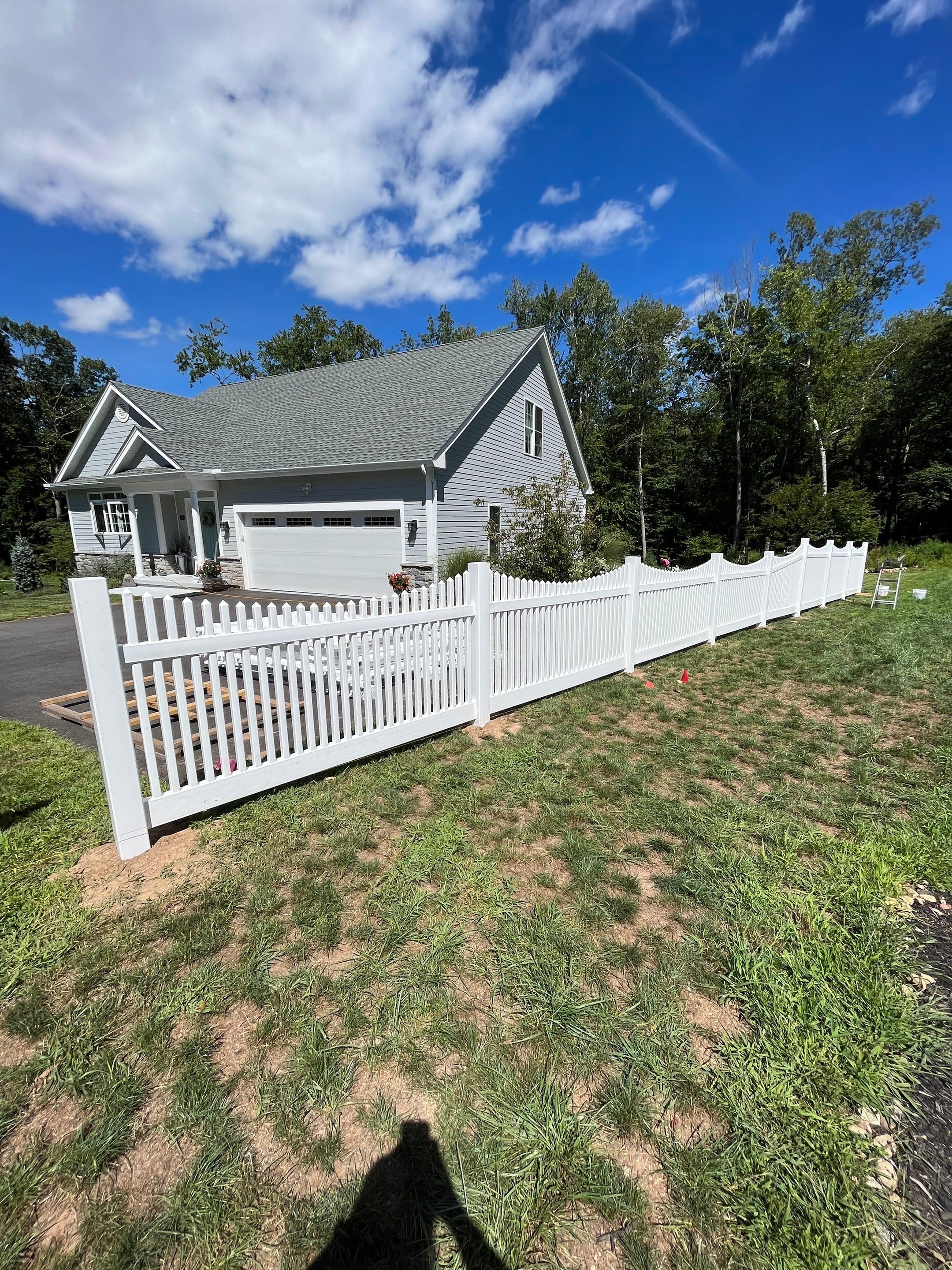 New Vinyl picket fence in white by DiGiorgi Roofing and Siding Inc