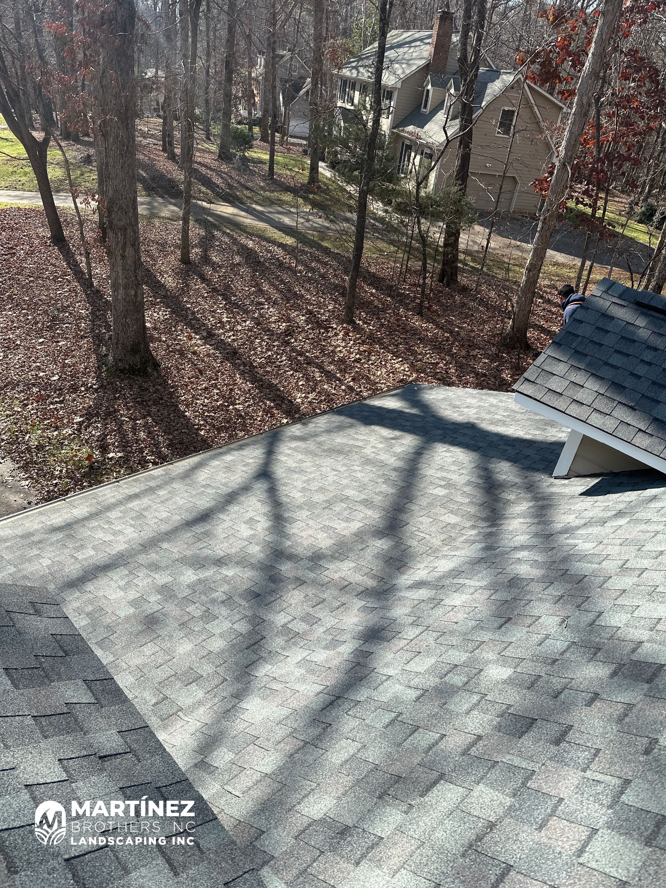 Leaf removal from gutters and yard by Martinez Brother’s Nc Landscaping Inc