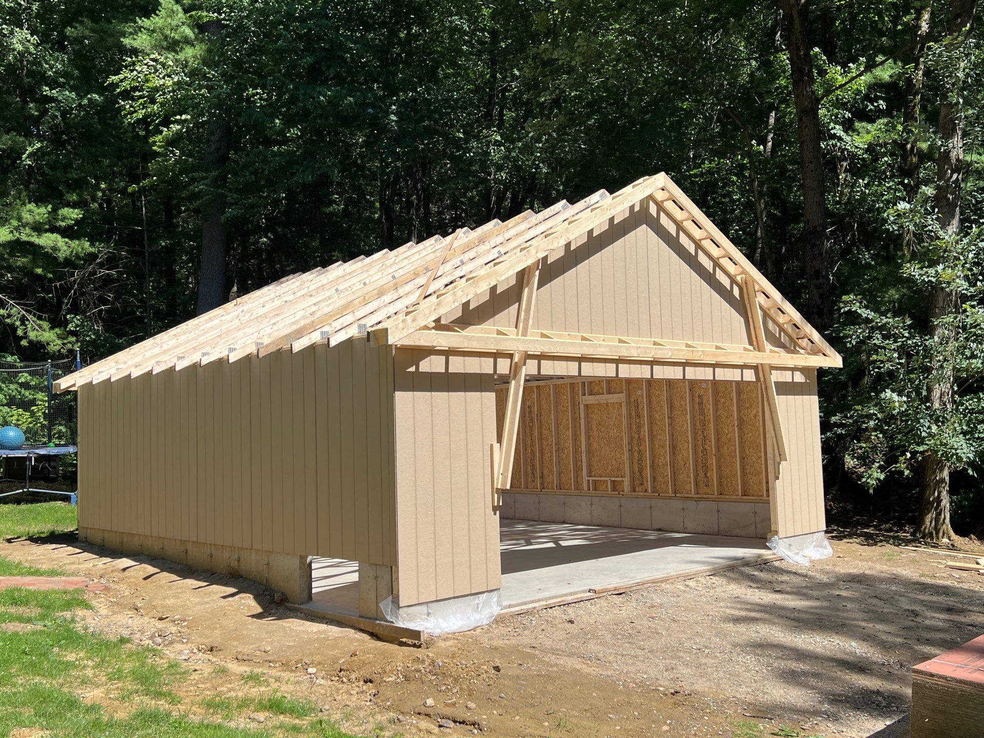 Garage using LP SmartSide Panel Siding by Chagnon Building & Remodeling LLC