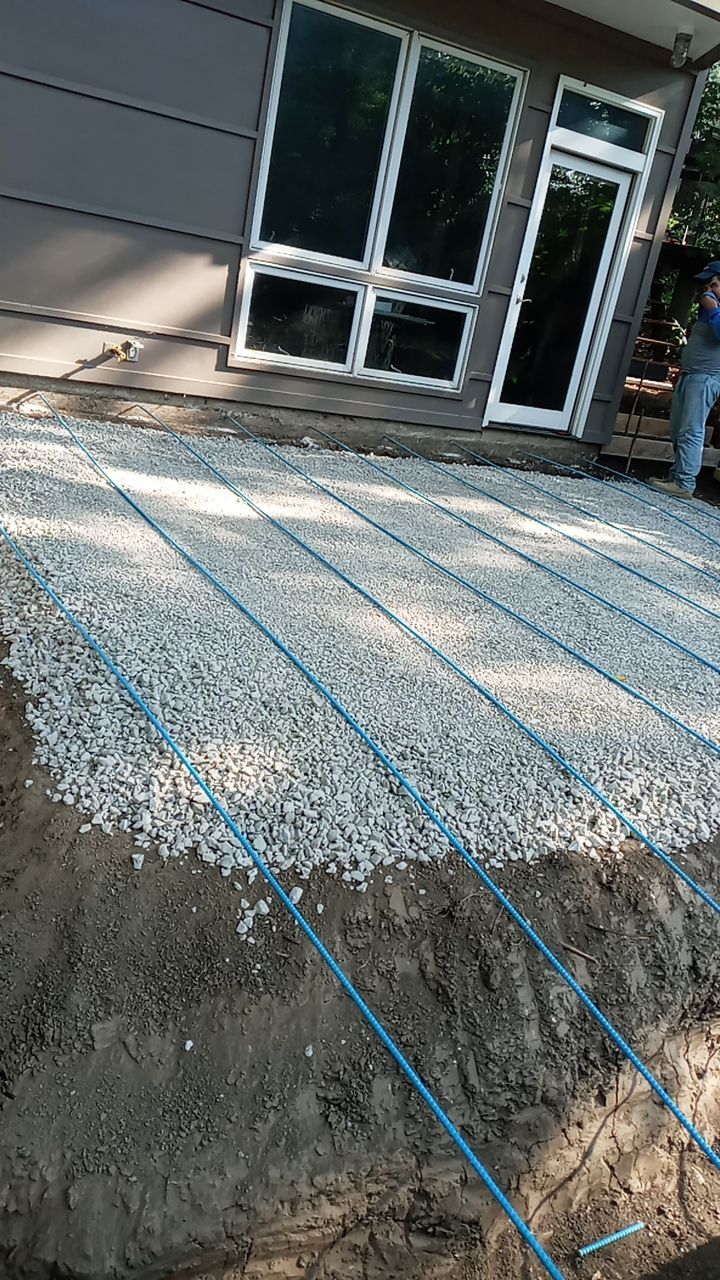 Back Yard Cantilivered Patio by LAND ESCAPES LLC