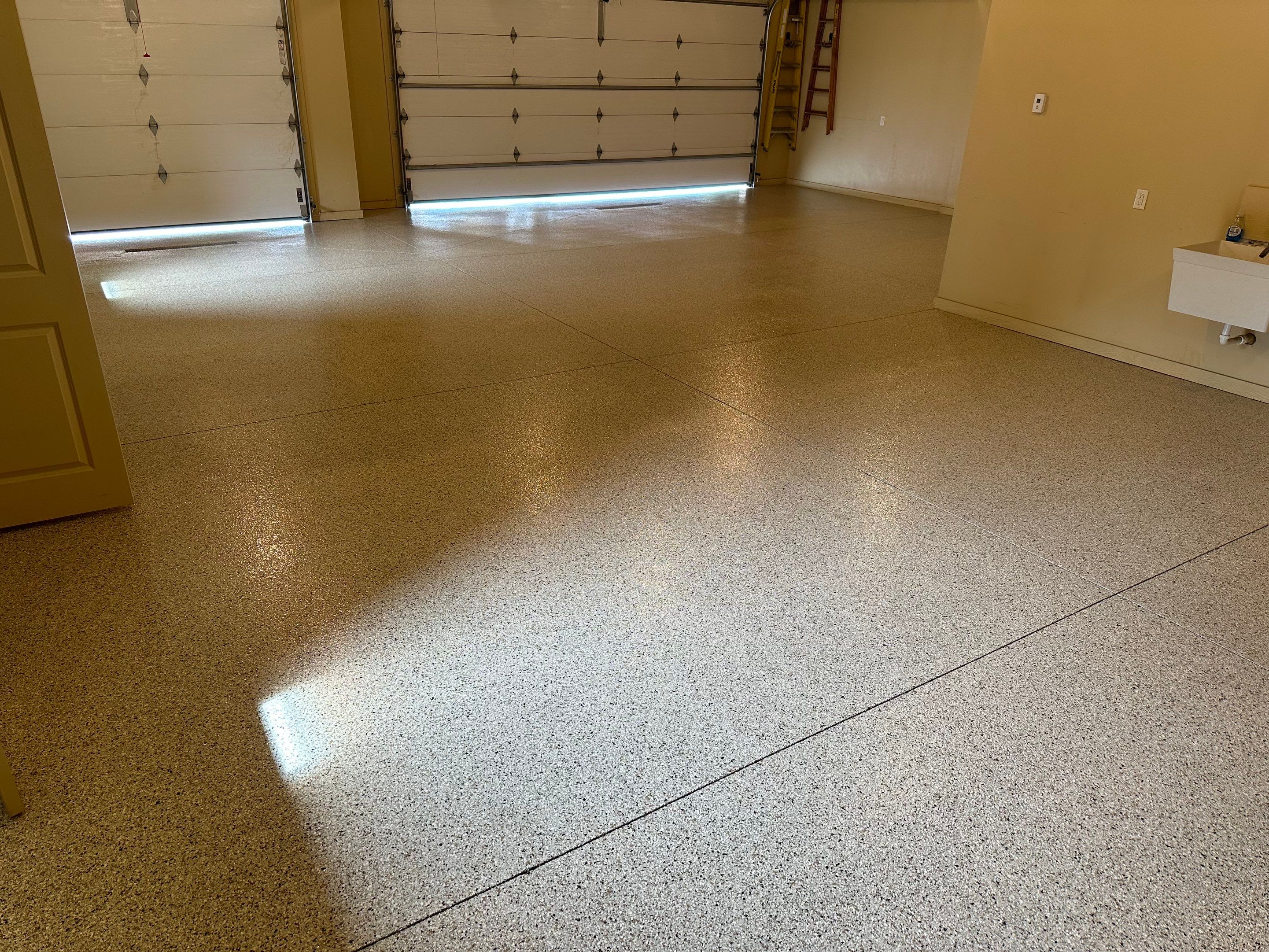 Sioux Falls Garage Floor Concrete Coating with Shoreline Flake Finish by Select Painting, Coatings & Garage Cabinets