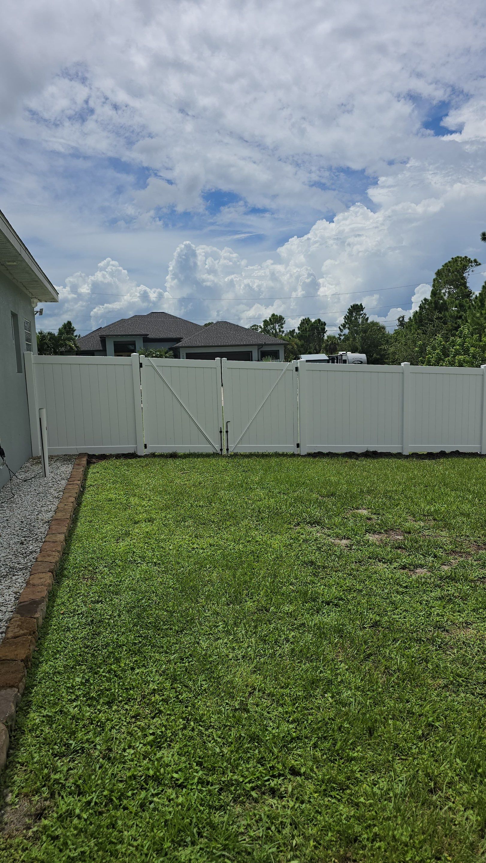 White Vinyl Privacy Fence Installation in Port Charlotte Florida by True Fence LLC