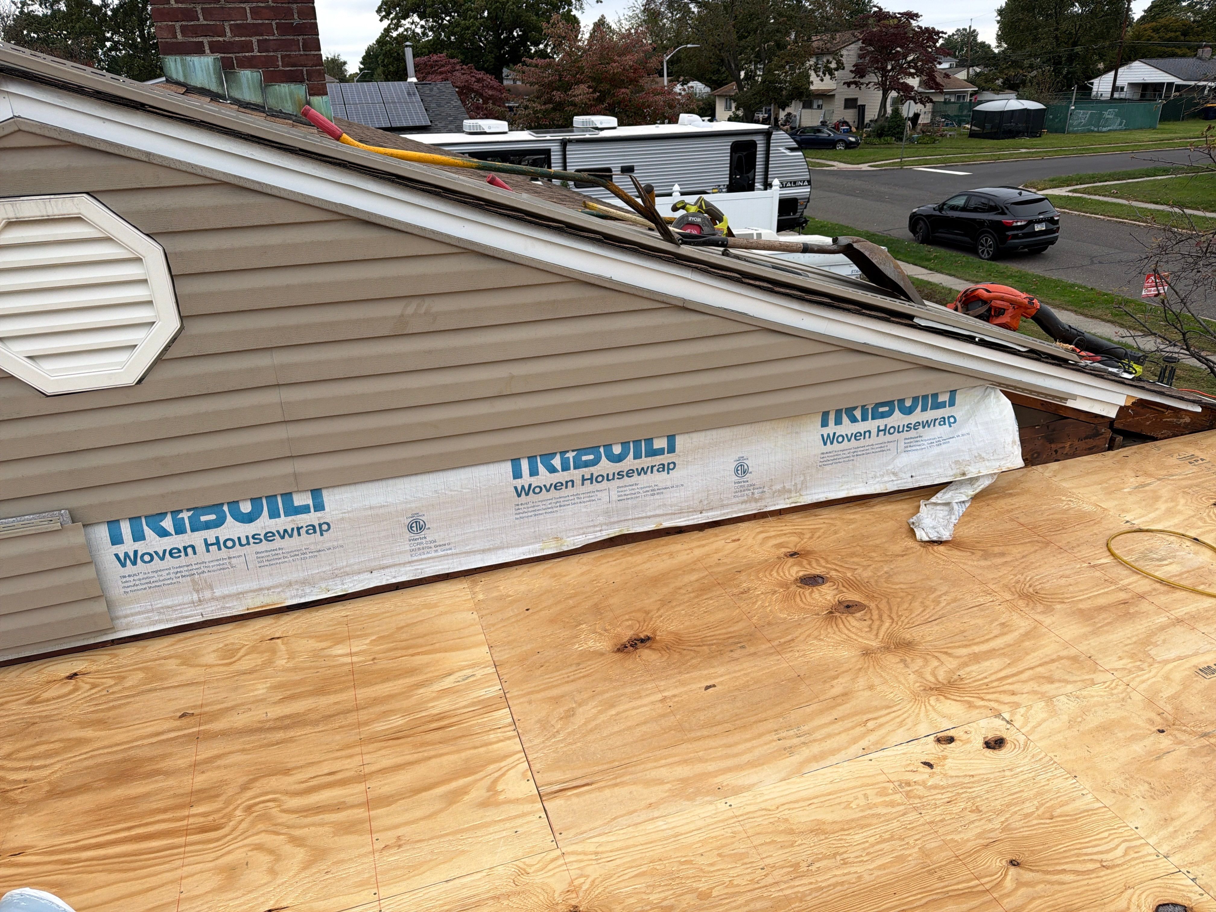 Flat Roof Replacement and Shingle Integration in Levittown by Stofan Construction LLC