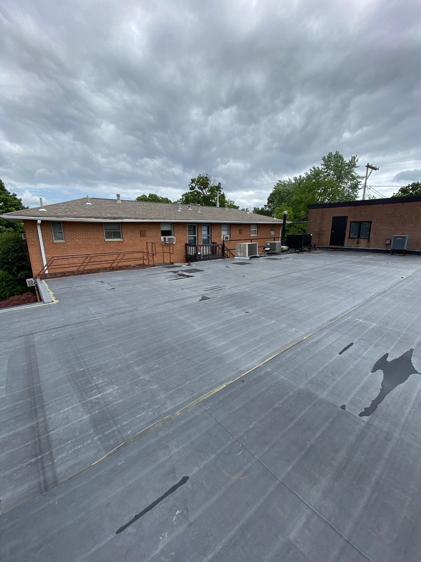 Commercial Roofing Installation using 60 mil rubber roof  by Nitro Roofing and Construction