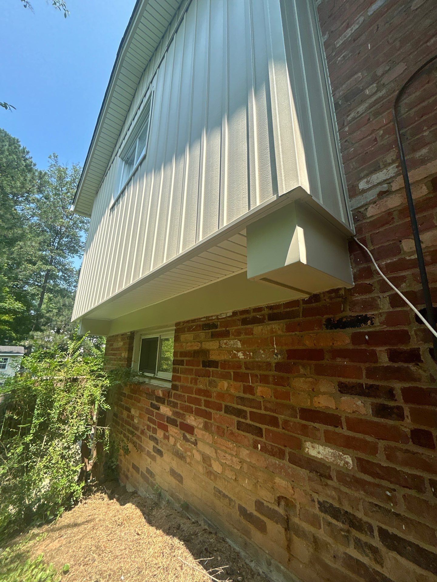 Fairfax: Residential Siding Replacement with CertainTeed 8" Board and Batten Siding in Desert Tan by RM Banning, Inc.