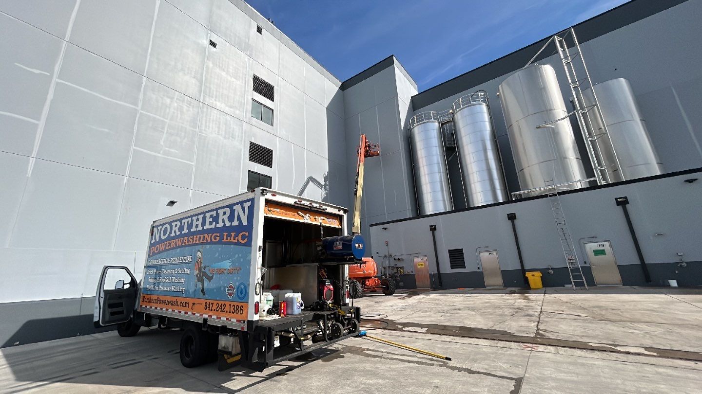 Oil removal using hot water and environmentally friendly degreaser by Northern Power Washing LLC.