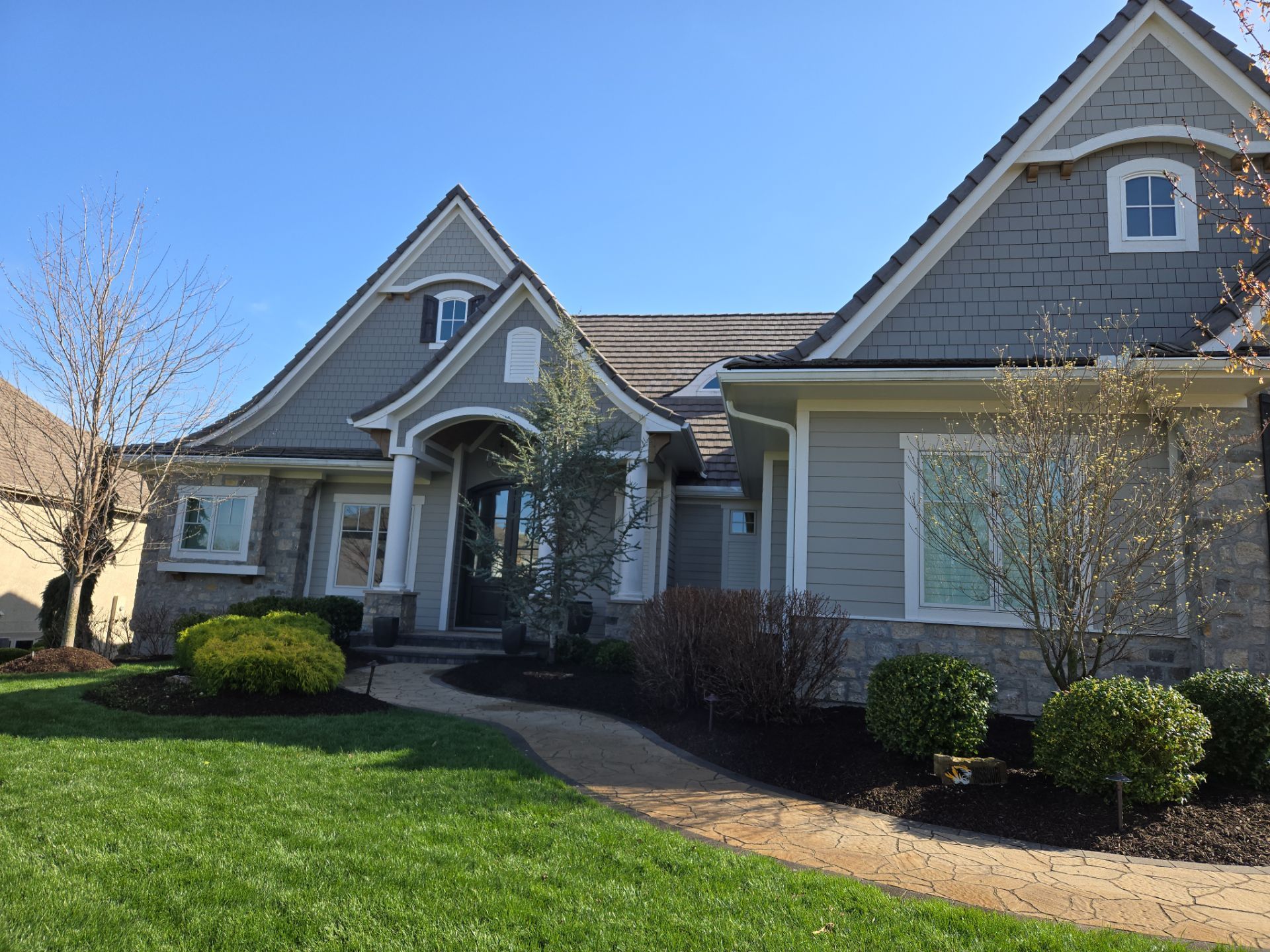 Front Yard Landscape and Walkway Renovation in Overland Park by LAND ESCAPES LLC
