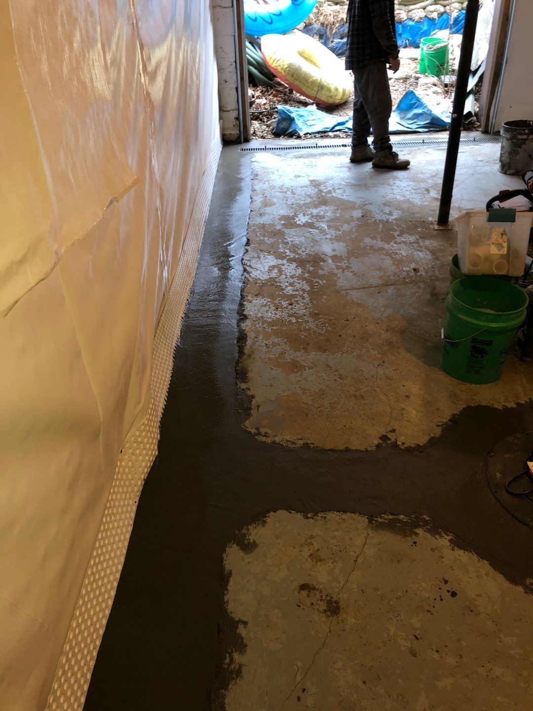 Basement Waterproofing using Drain tile system and a foundation wrap by ACE Waterproofing & Basement Solutions