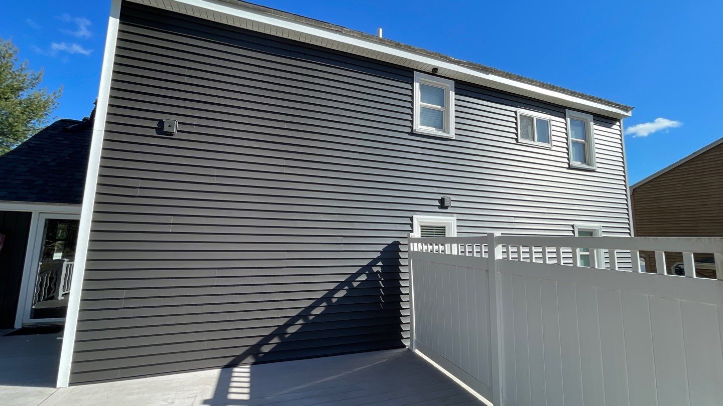 Complete Exterior Renovation with New Siding & Gutters   by Sensible Home Solutions