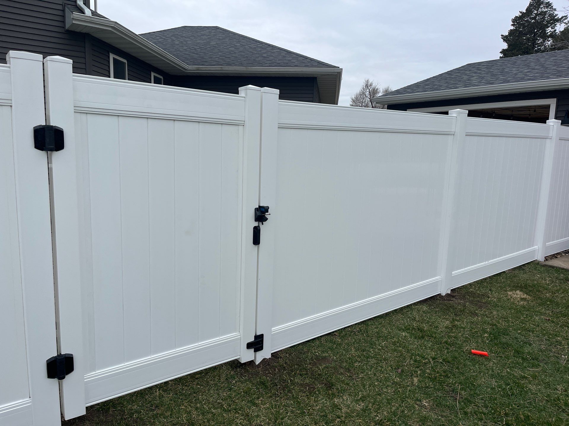 White Vinyl Privacy and Black Chain Link Fencing in Buckingham by Perfect Picket Fence and Stain