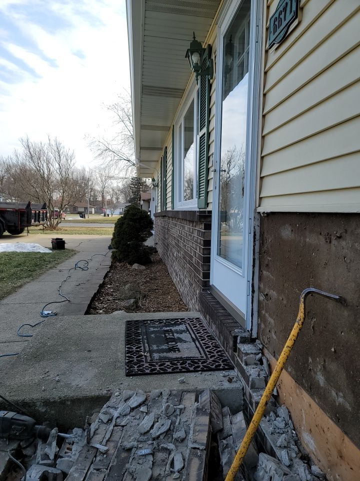 taking down brick wall & installing siding by Kraz Construction