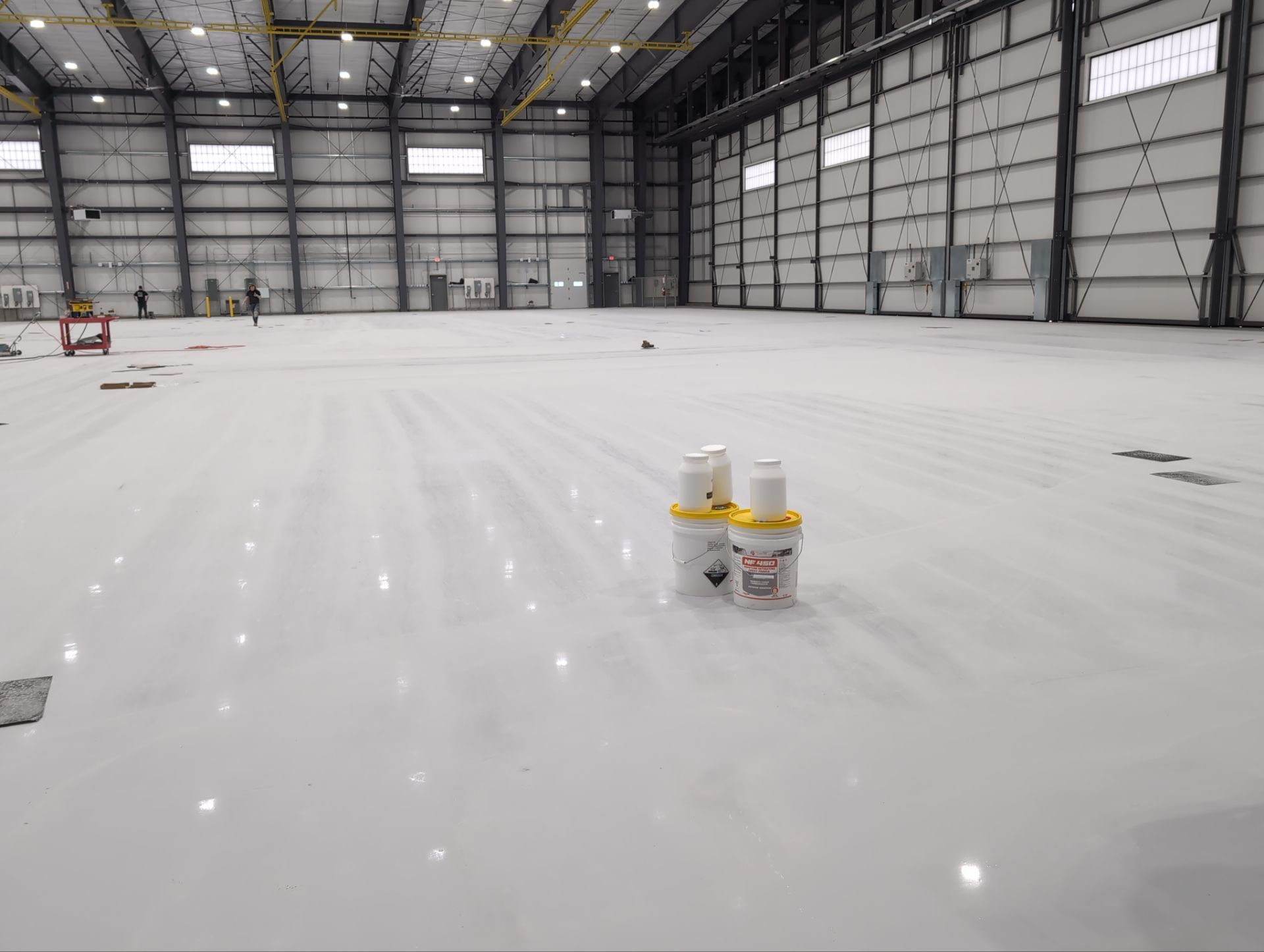 Airplane Hanger using Light Grey Commercial Penntek Epoxy by Croc Coatings, LLC