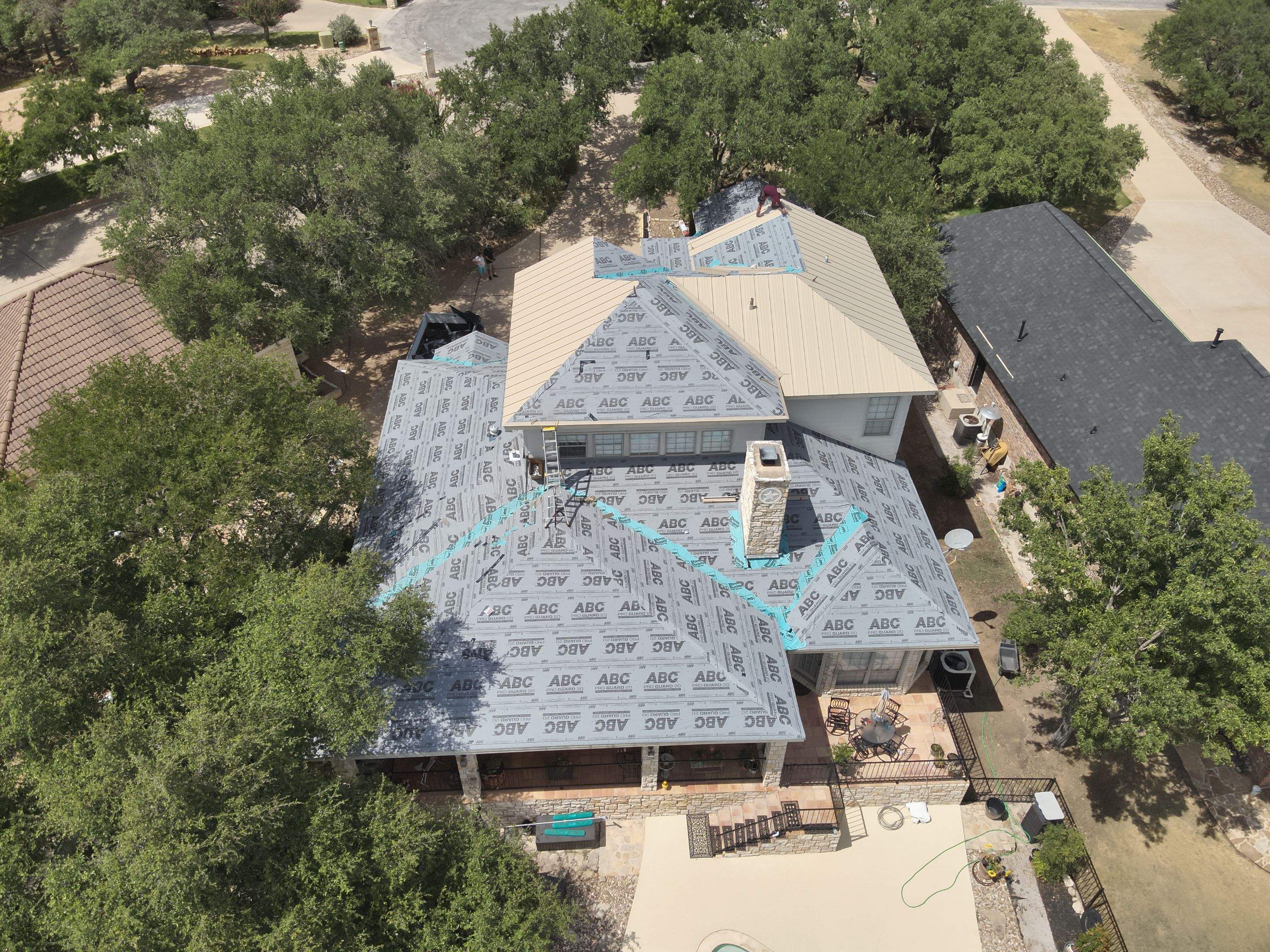Residential Roof Replacement using 24 GA Double-Lock - Surrey Beige by Action Exteriors Austin
