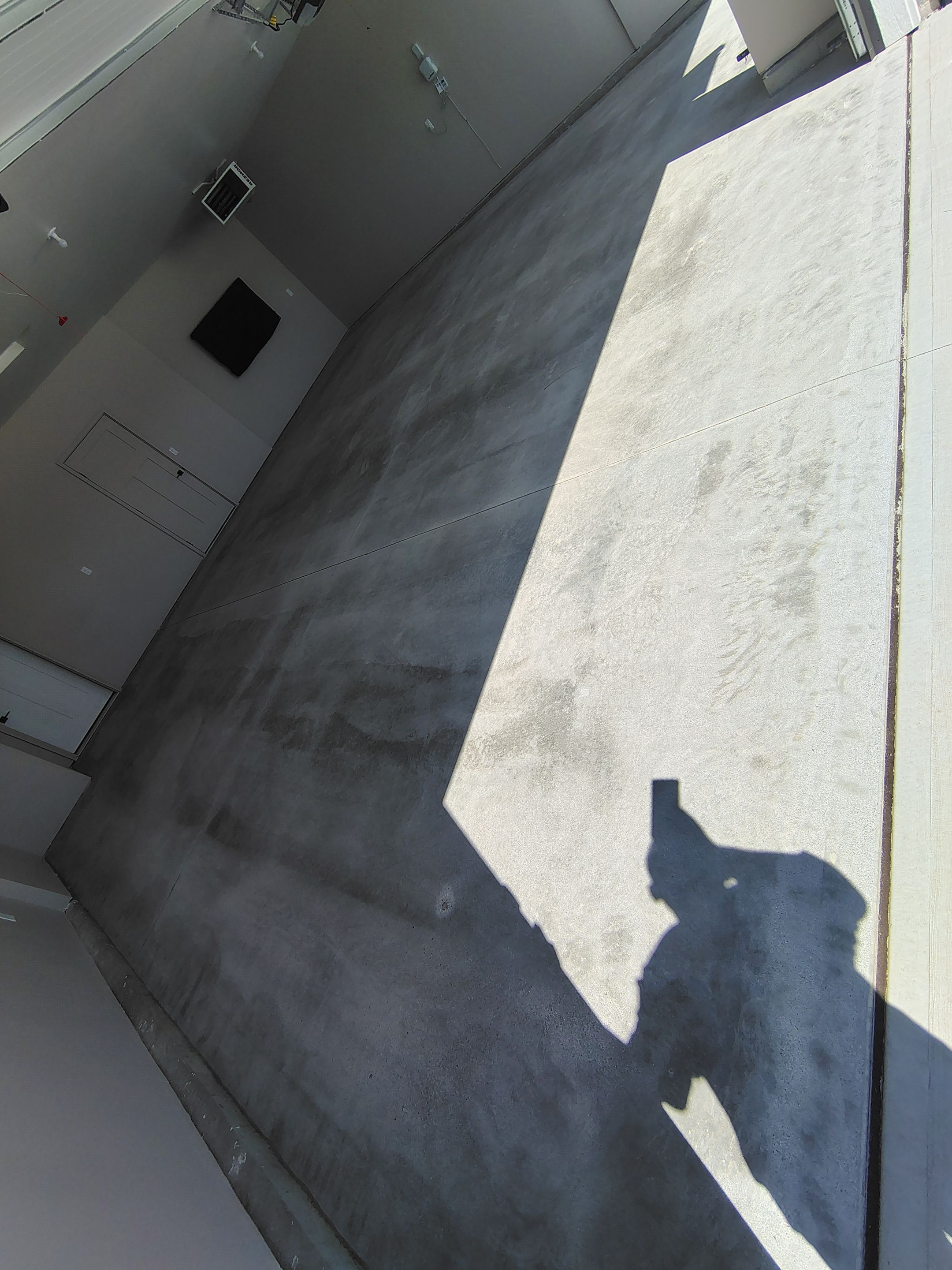 Full Speckled Concrete Coating for Sioux Falls Garage by Select Painting, Coatings & Garage Cabinets