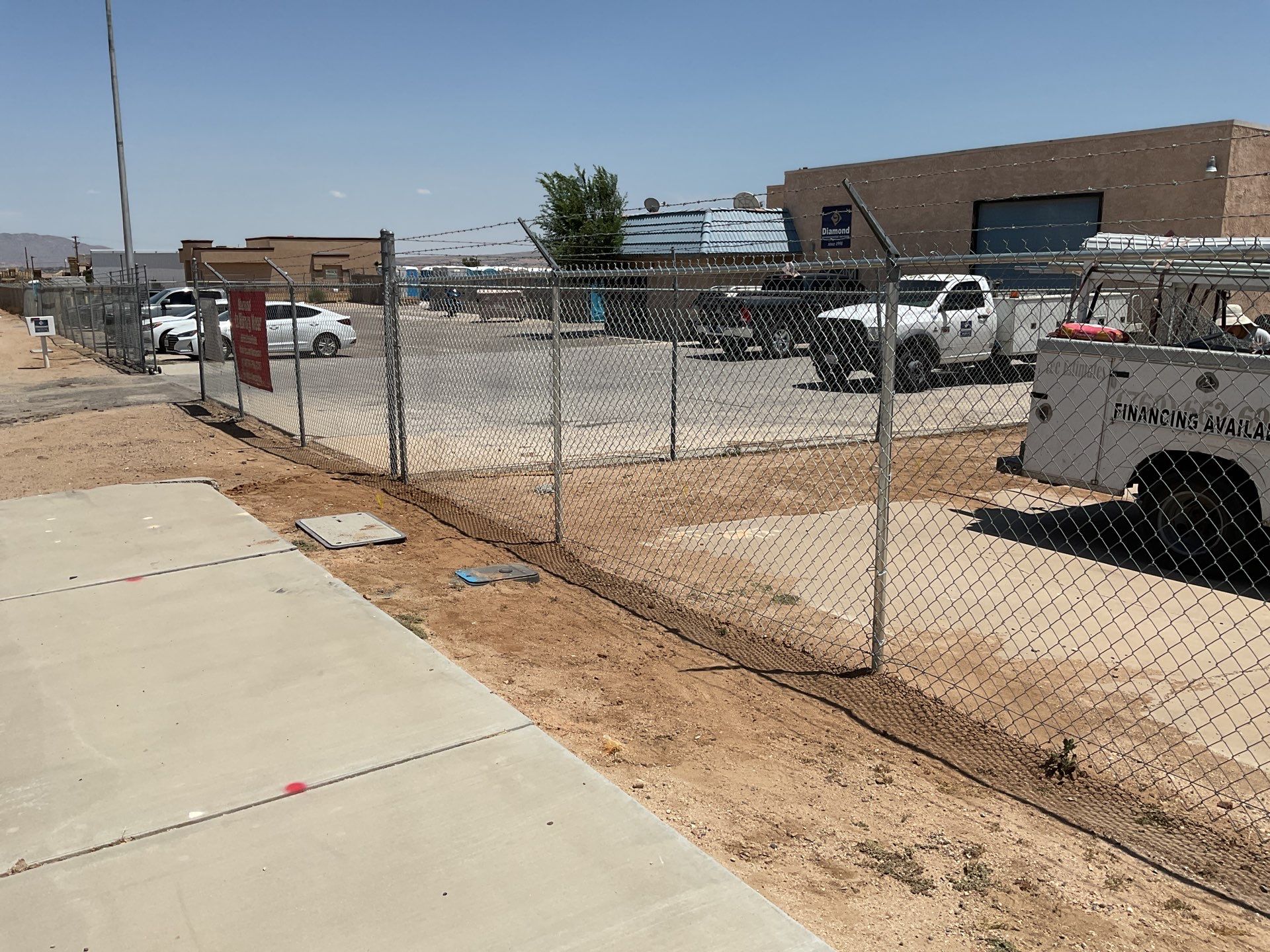 Commerical Fence Repair using Chain-Link with Barbed Wire by Fence Guys Inc. 