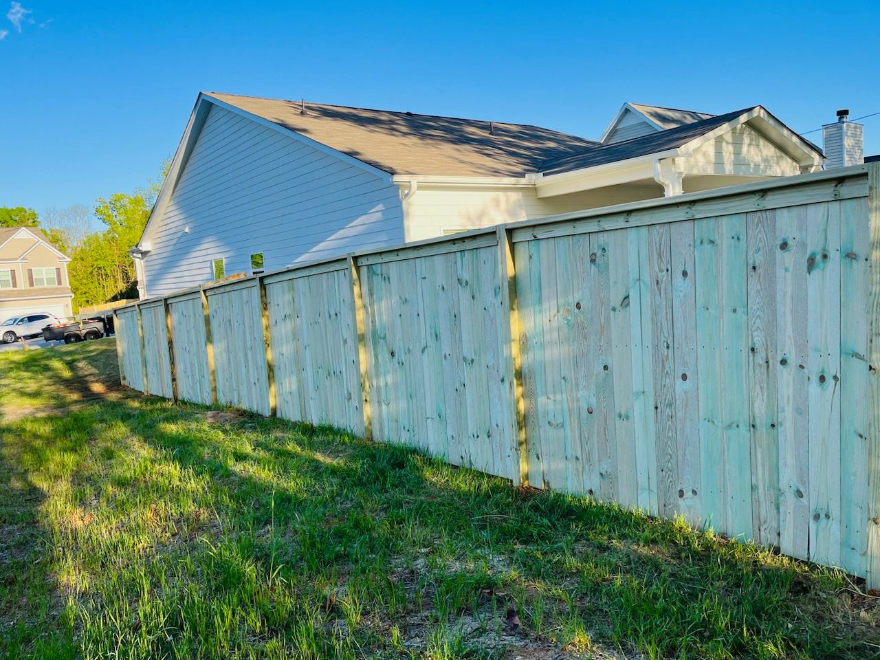 Wood Privacy with Decorative Top Cap by Titans of Timber Fence & Stain