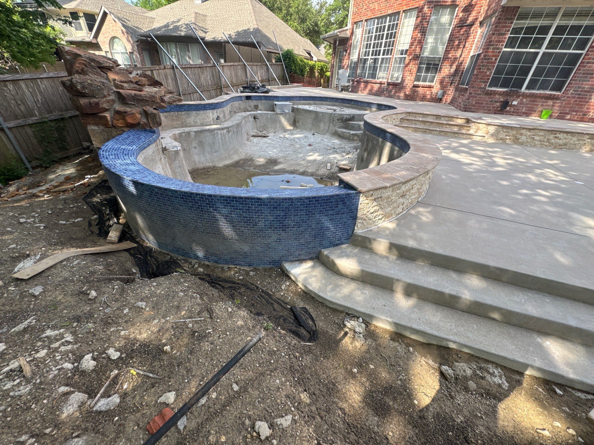 Freeform Pool with Rock Waterfall and Raised Spa by Pinnacle Pools and Spas - DFW