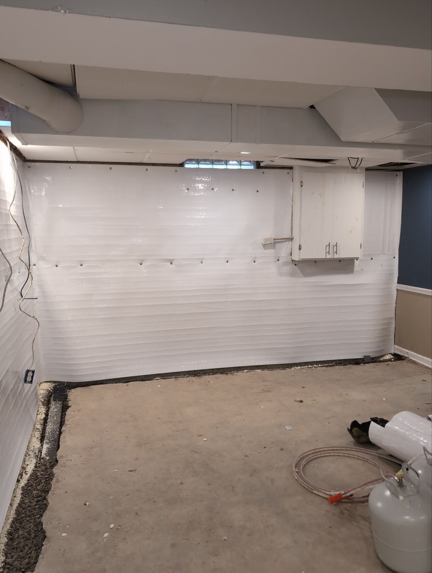 Interior Basement Waterproofing System and Egress Window Installation by Toledo Basement Repair 