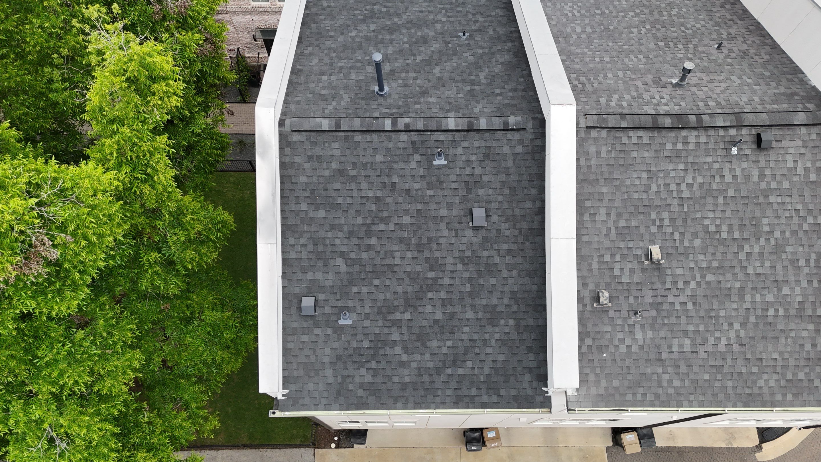 Residential Roof Replacement using TAMKO -  Stormfighter IR - Rustic Black by Action Exteriors Austin