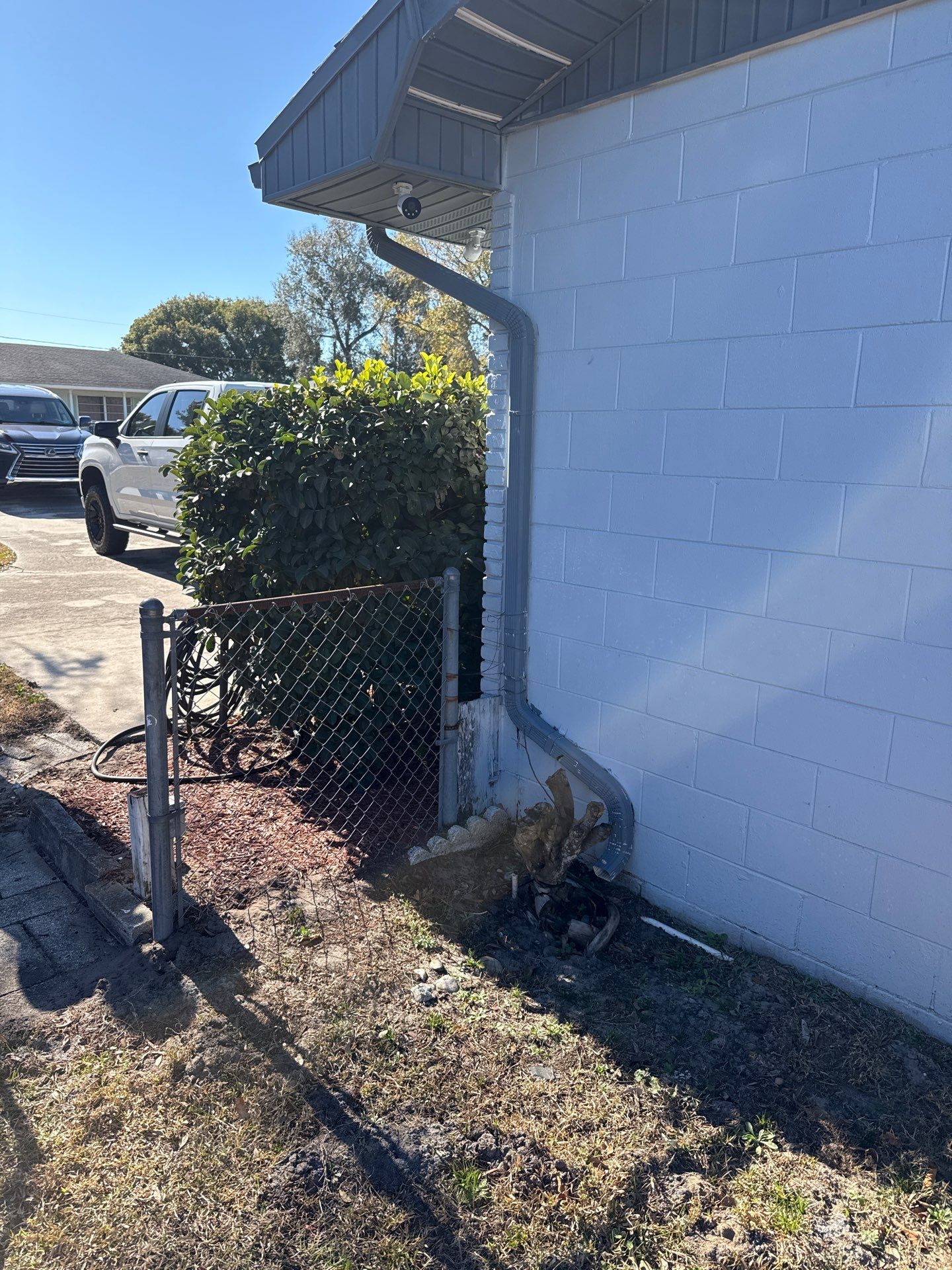 Downspout Installation using Downspout Extension and new Gutters in Winter Haven FL by Gutter Professors