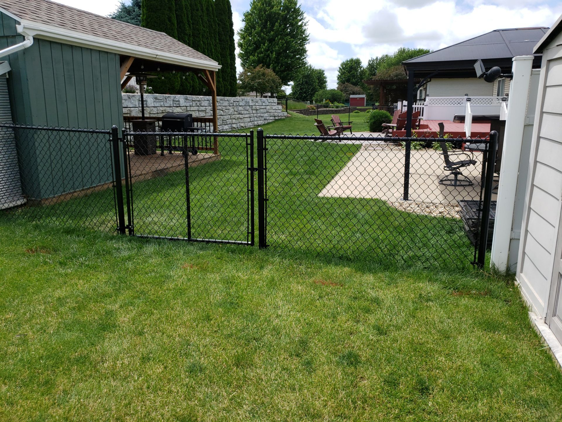 Black Vinyl-Coated Chain Link Fence Installation in Denver by Perfect Picket Fence and Stain