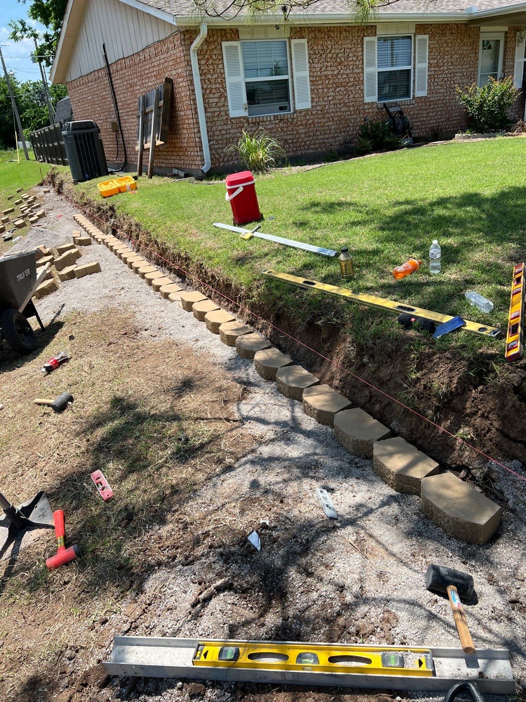 Retaining Wall using Rocks by Clays Services Inc
