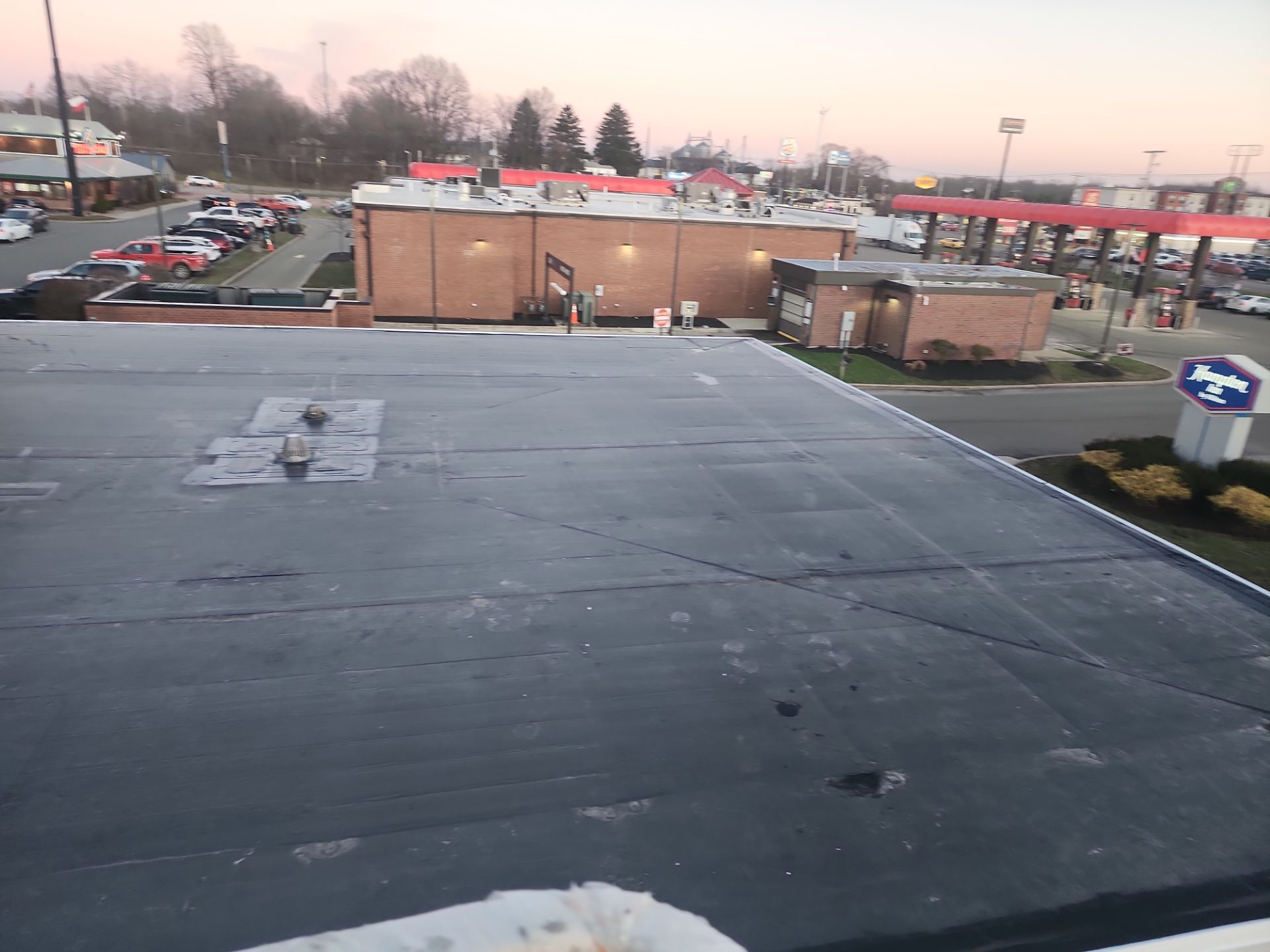 Commercial Roofing Installation using 60 mil rubber roof  by Nitro Roofing and Construction