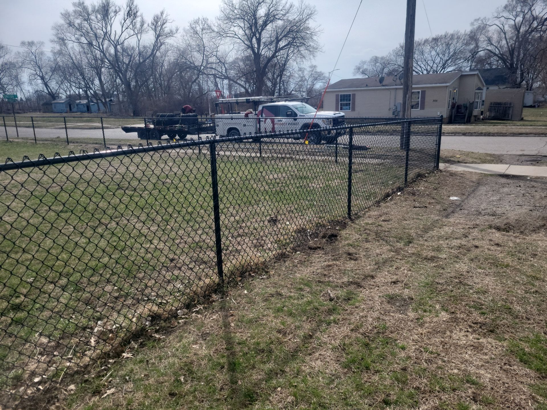 Black Chain Link Fence and Gate Installation in Waterloo by Perfect Picket Fence and Stain