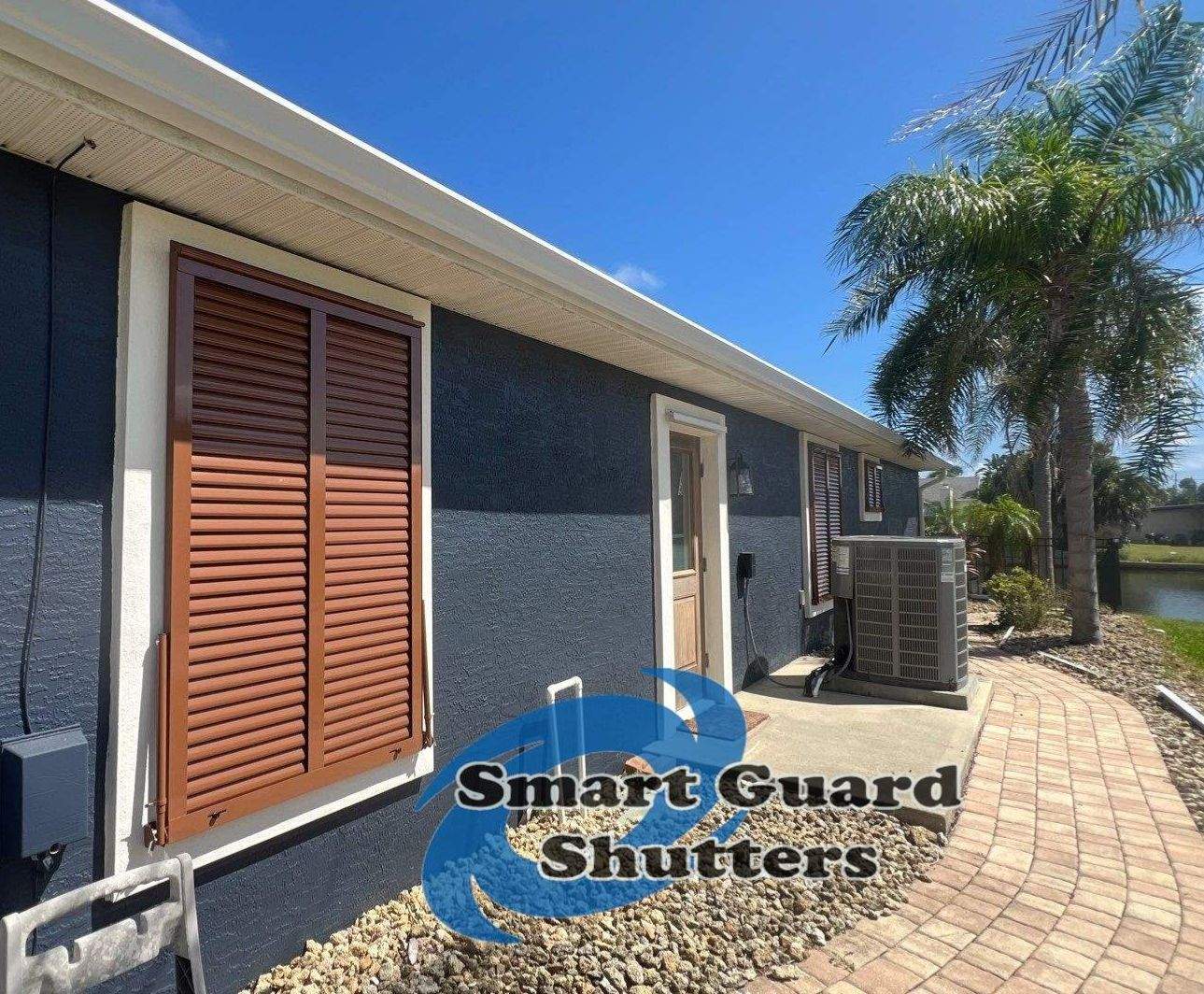 Impact Rated Bahama Shutters in Beige Brown by Smart Guard Shutters
