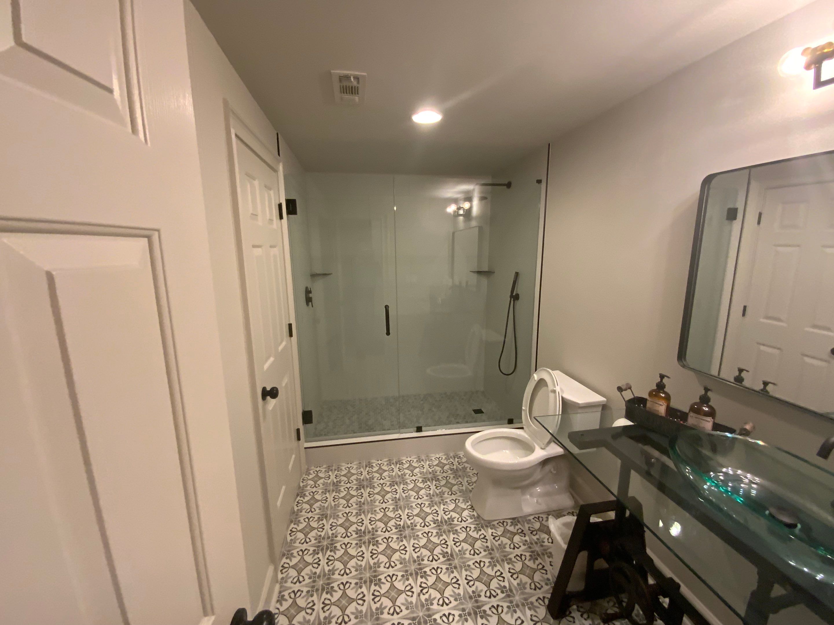 Finished Basement Renovation Featuring Home Theater and Custom Wine Cellar by Swift Home Renovations