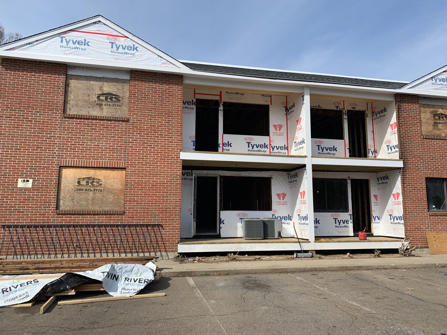 Commercial Roofing Installation using EPDM with white gutters by A Plus Exterior