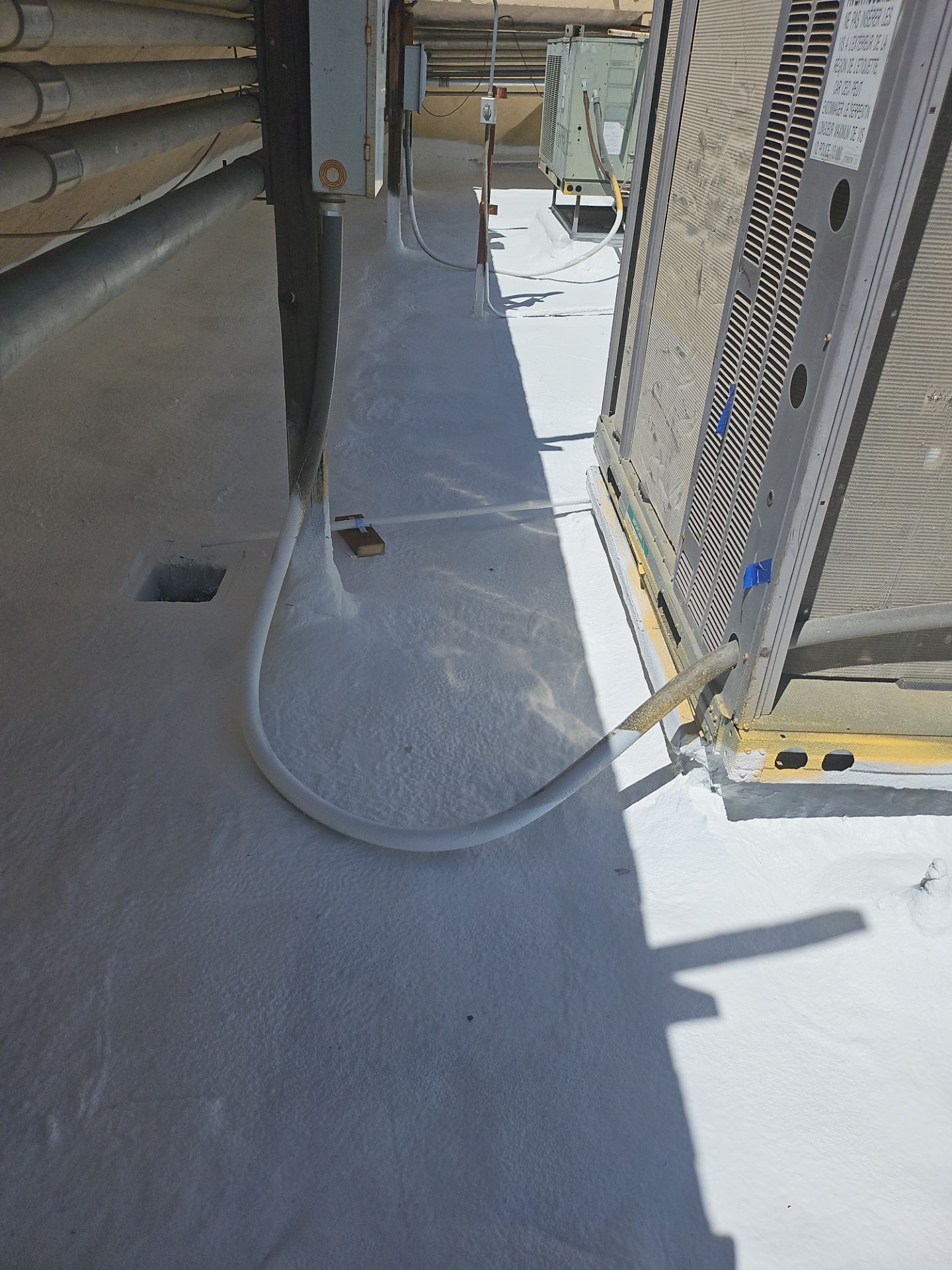 Spray foam and coatings using General Coatings acrylic coatings and spray foam by Straight Edge Roofing Inc