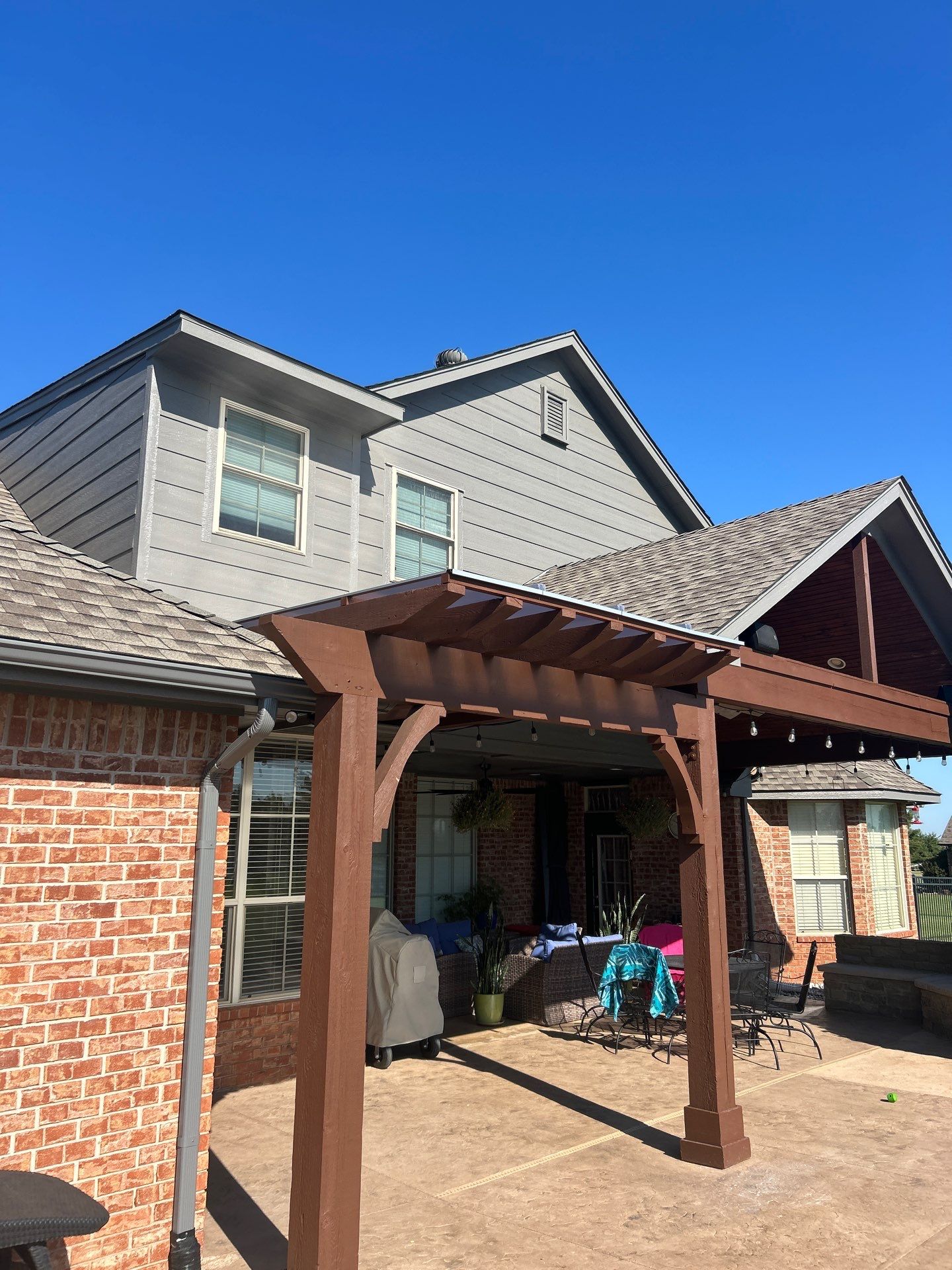 Siding Replacement and Exterior Painting and Pergola Cover Install in Edmond, OK by McCann's Roofing and Construction