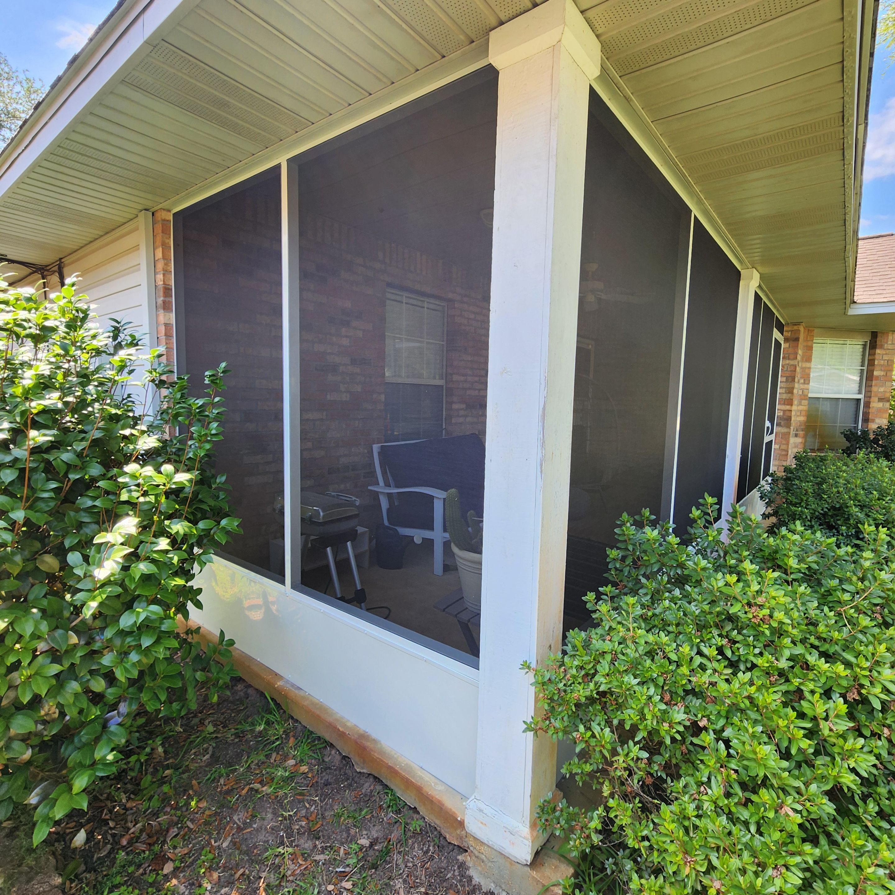 Screen Under Existing Patio Cover by Titan Sunrooms