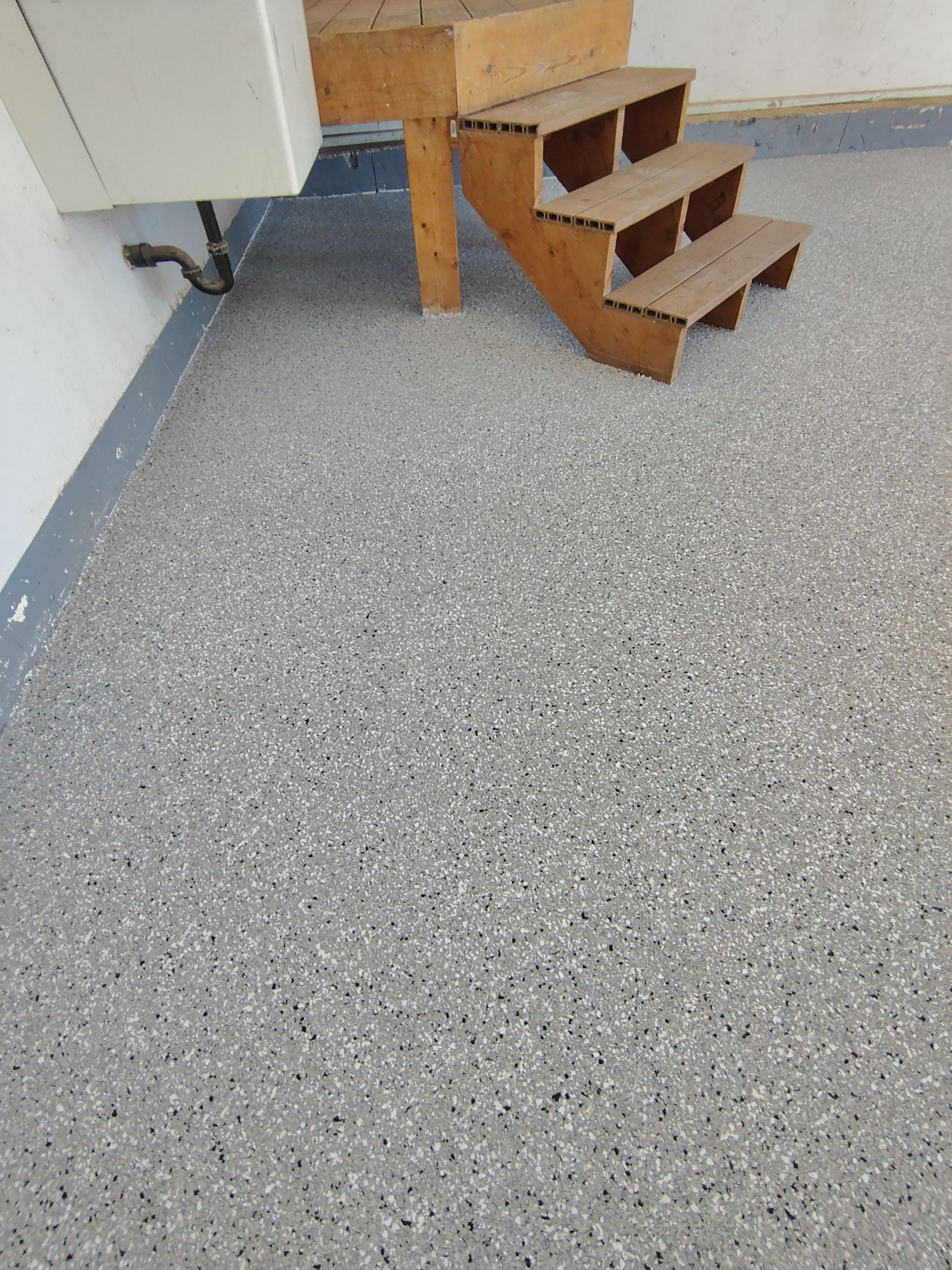 Feather Grey Garage Floor Coating Installation in Valley Springs by Select Painting, Coatings & Garage Cabinets