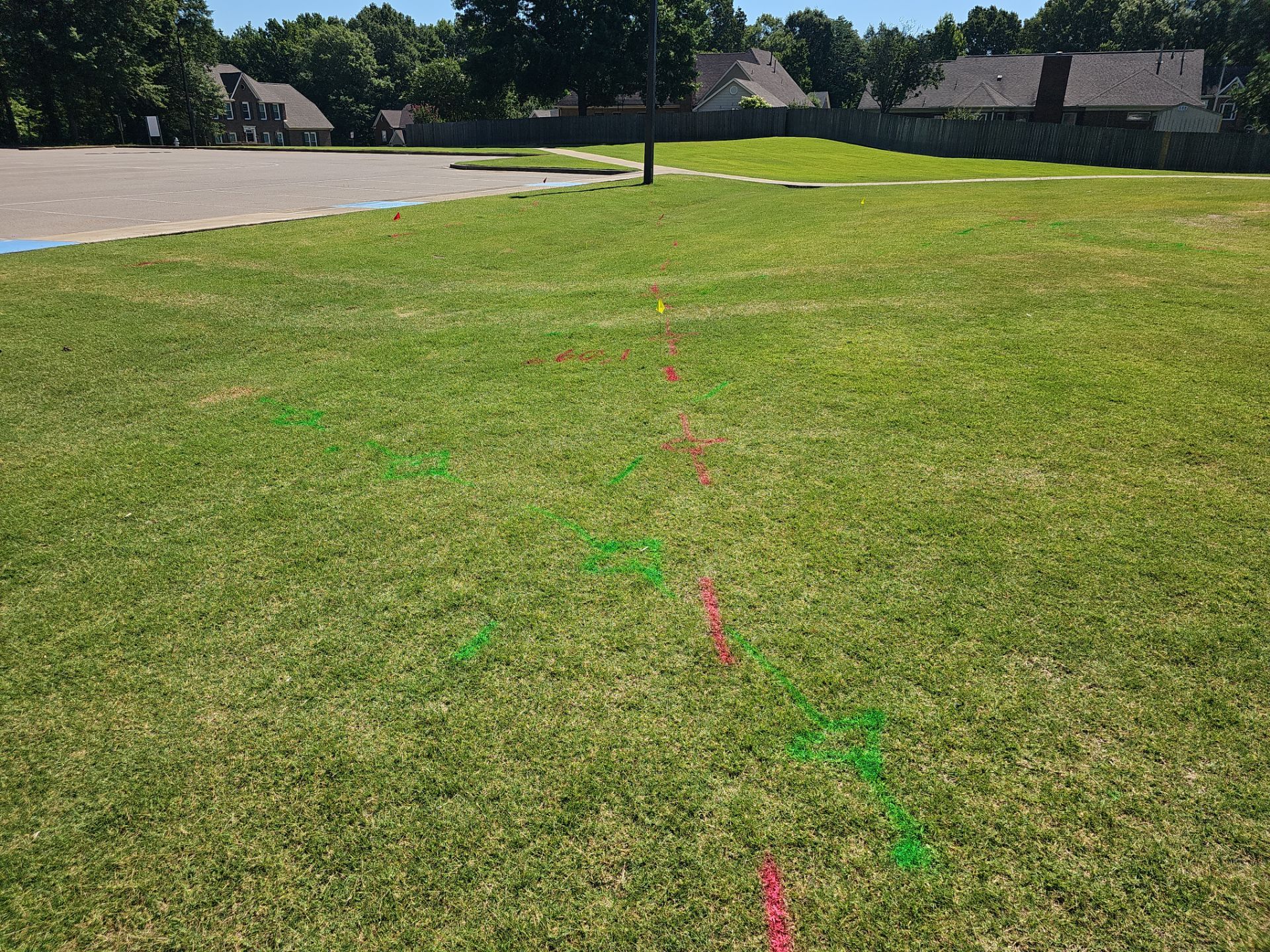 Utility Locating at a school for fence install by Alsip Locating Service, LLC