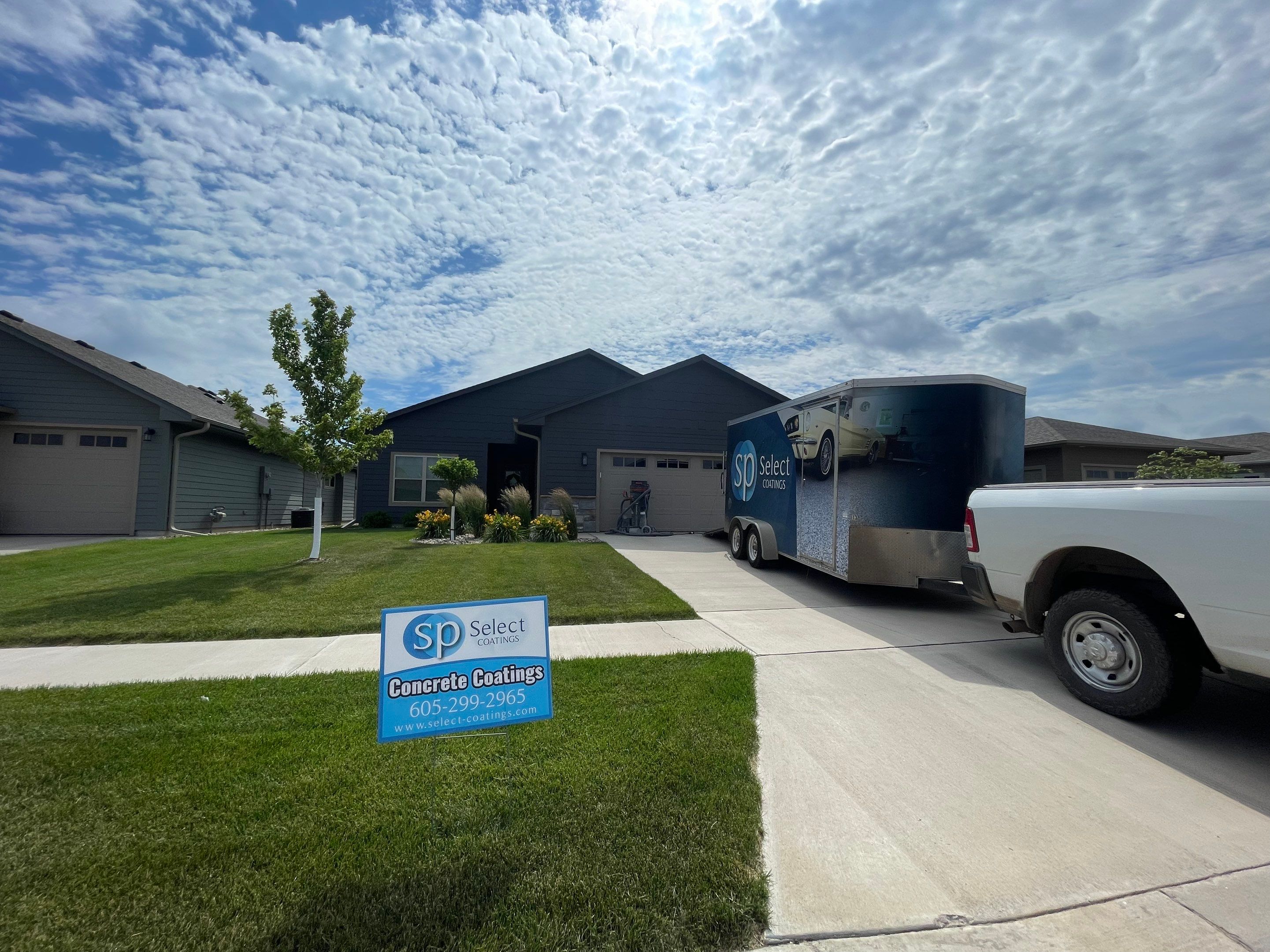 Textured Concrete Patio Coating and Custom Privacy Pergola in Sioux Falls by Select Painting, Coatings & Garage Cabinets