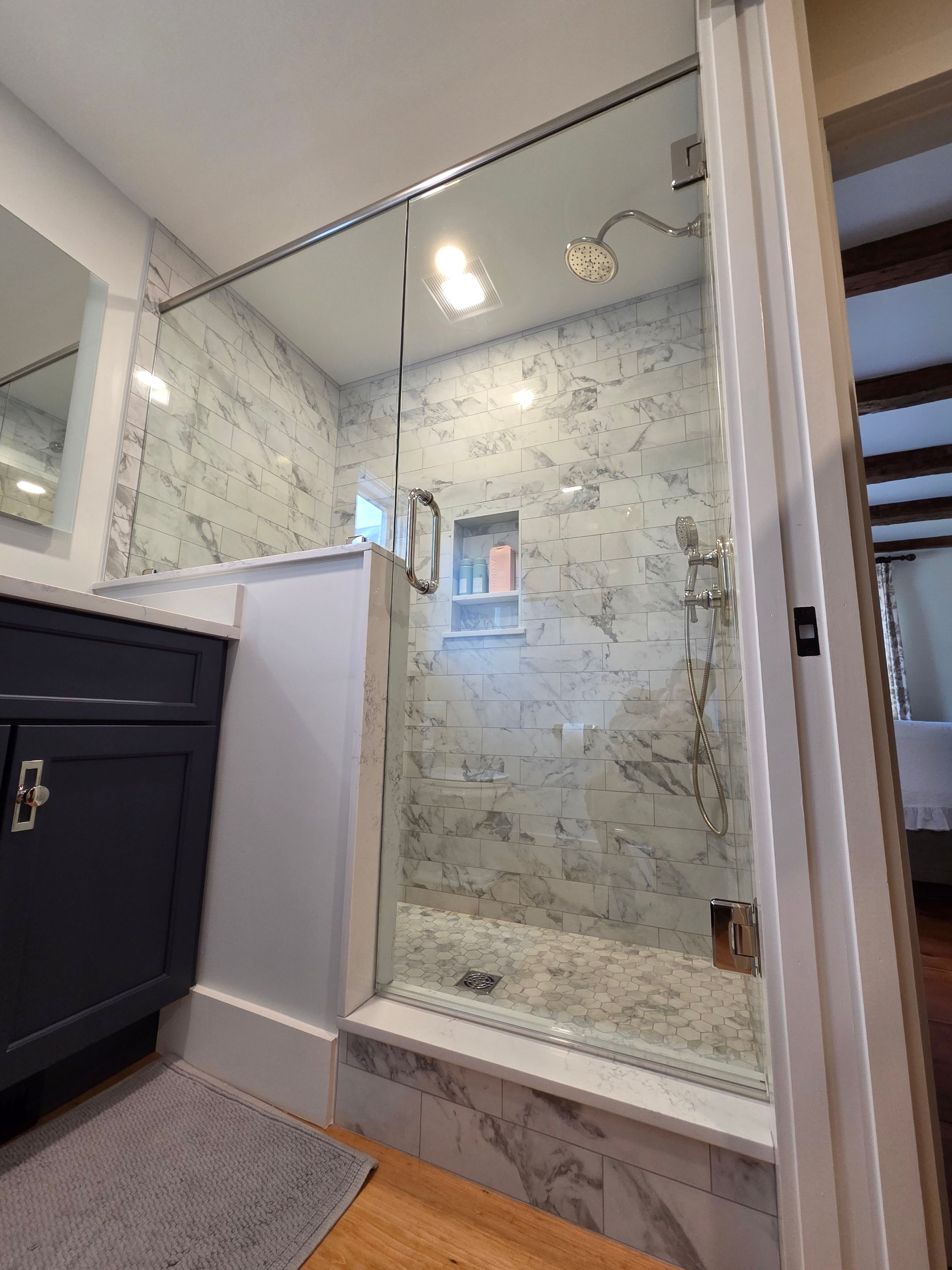 Frameless Shower Enclosure with Header Bar  by Cheshire Glass Company