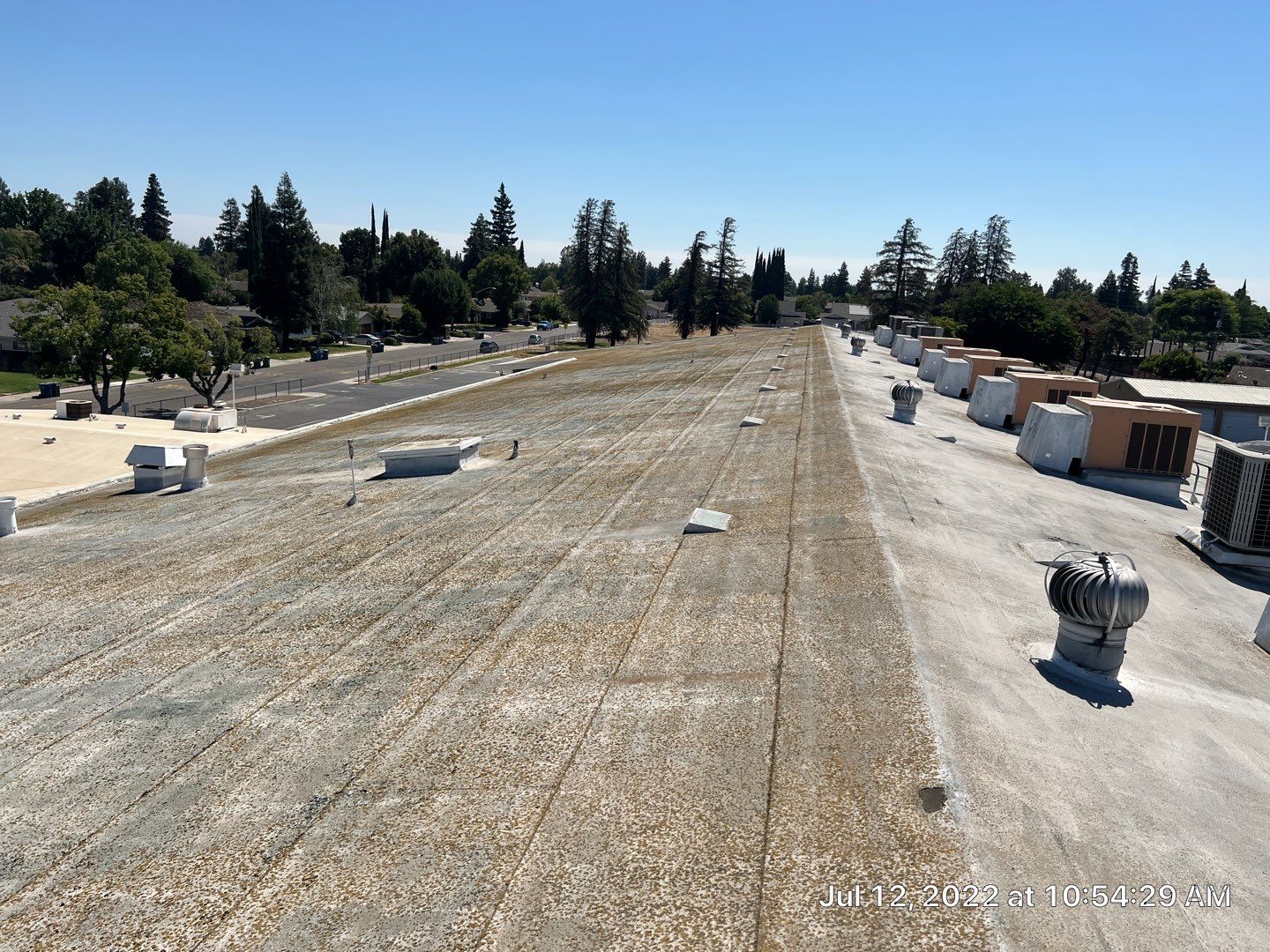 MR Roofing system using Benchmark/PUMA XL coatings over TPO single-ply roofing by Straight Edge Roofing Inc