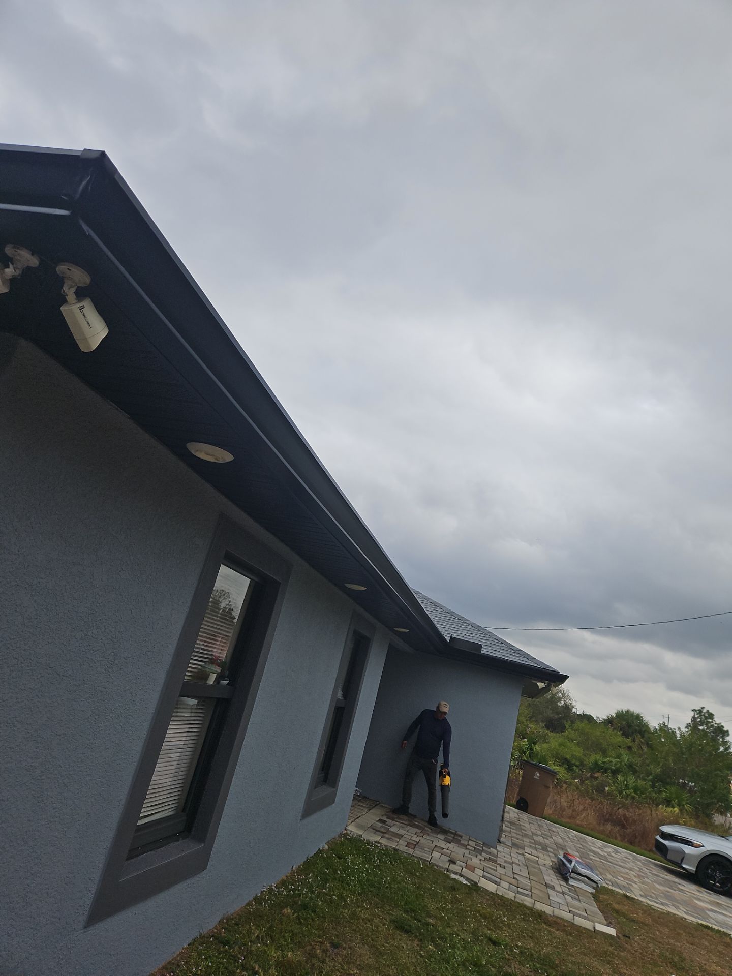 Black Seamless Gutters & Soffit/Fascia in Lehigh Acres FL by Gutter Professors