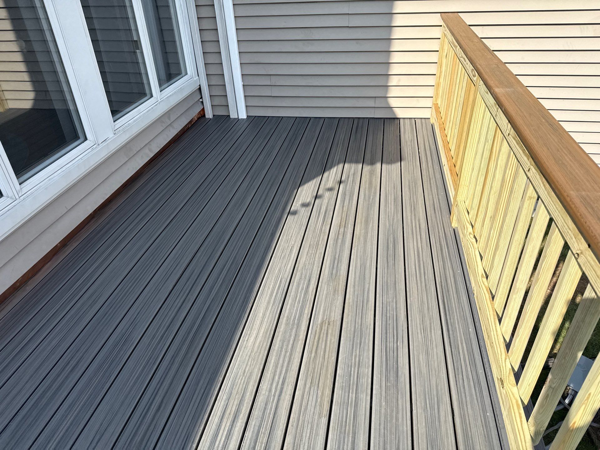 Deck replacement using trex Tropical Island mist and Pressure treated railings. by DiGiorgi Roofing and Siding Inc