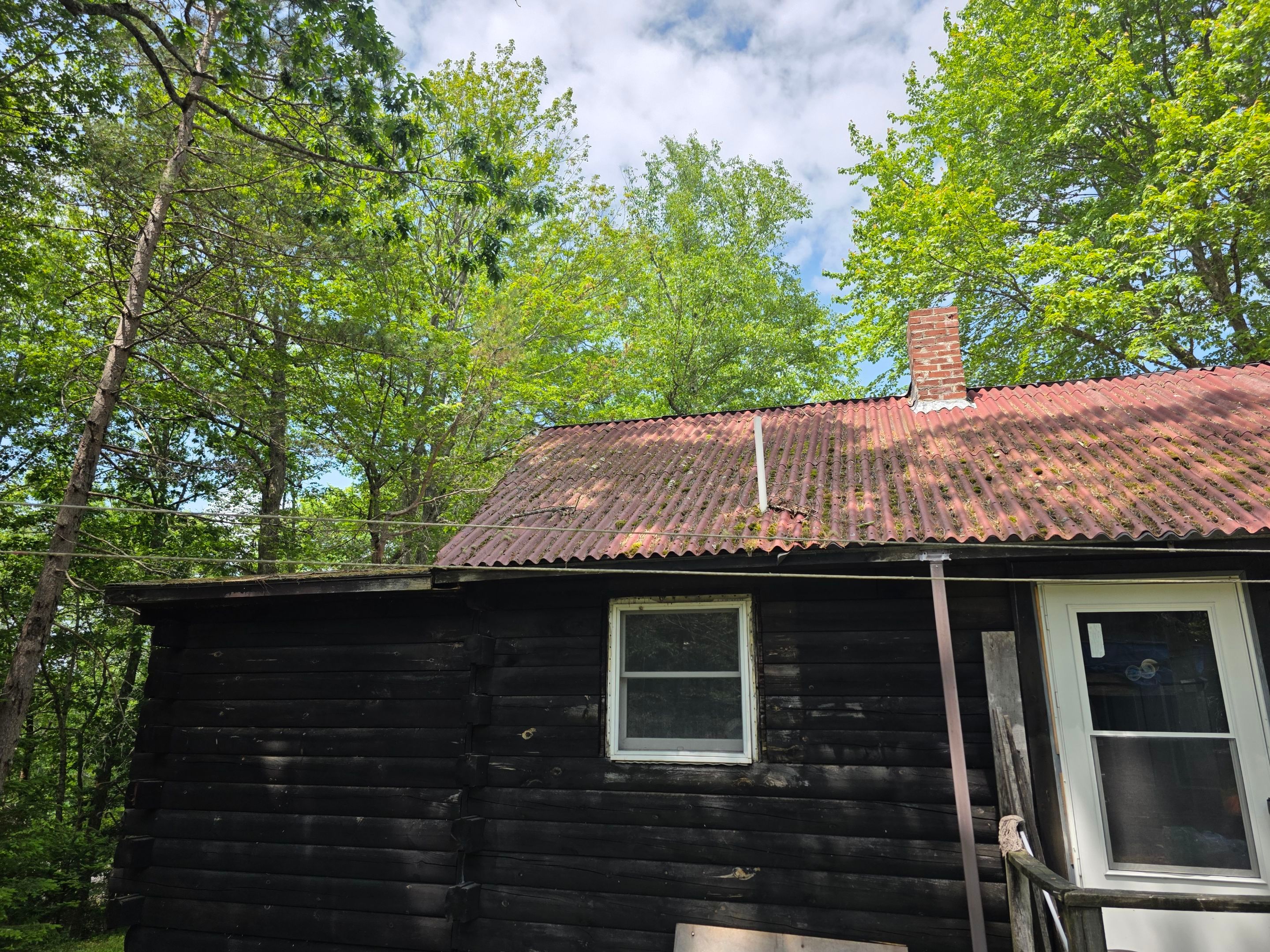 Cabin In the Woods by The B.A.R Roofing
