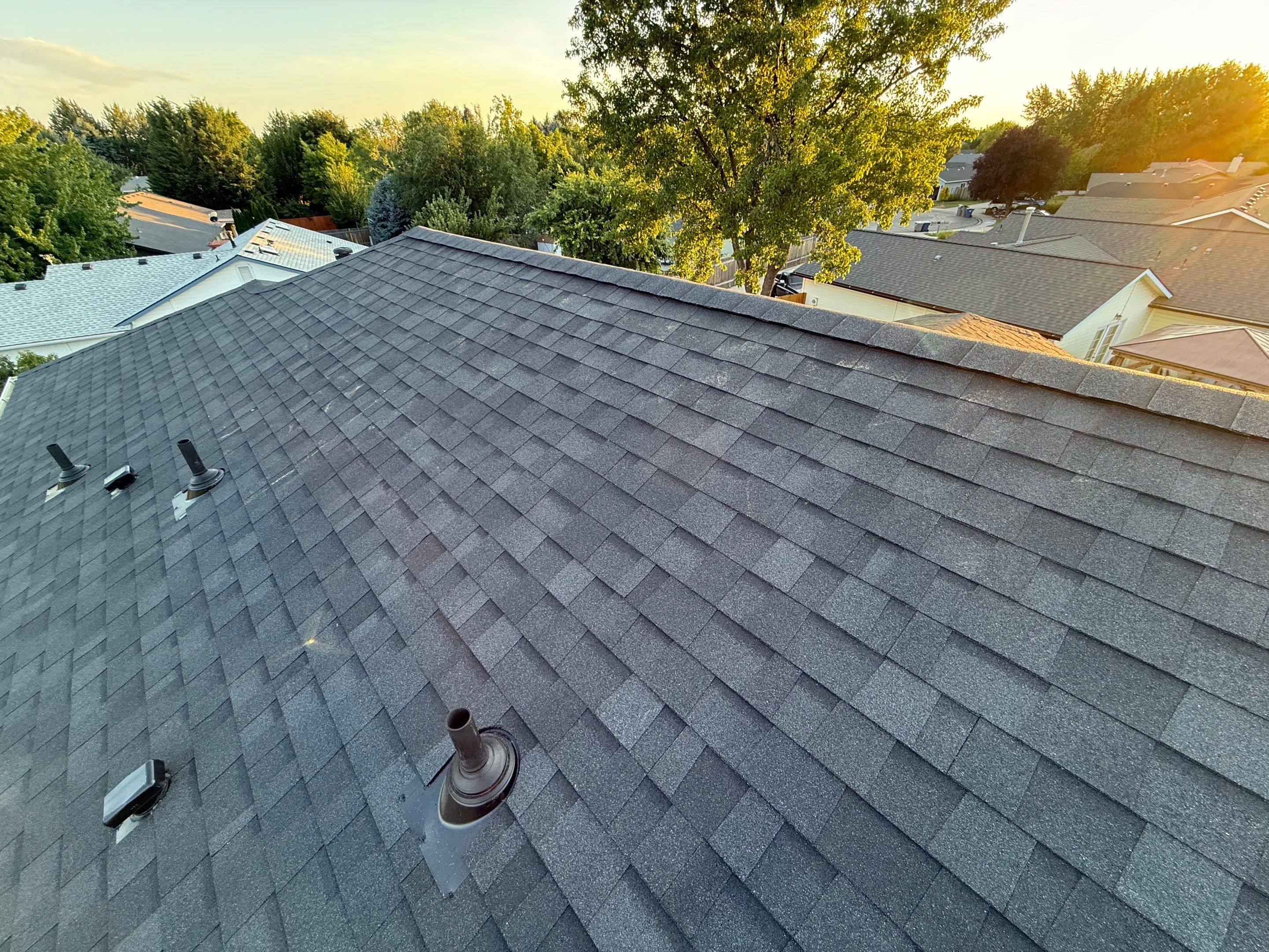 Residential Roof Replacement and Seamless Gutter Installation in Boise by Olive Roofing