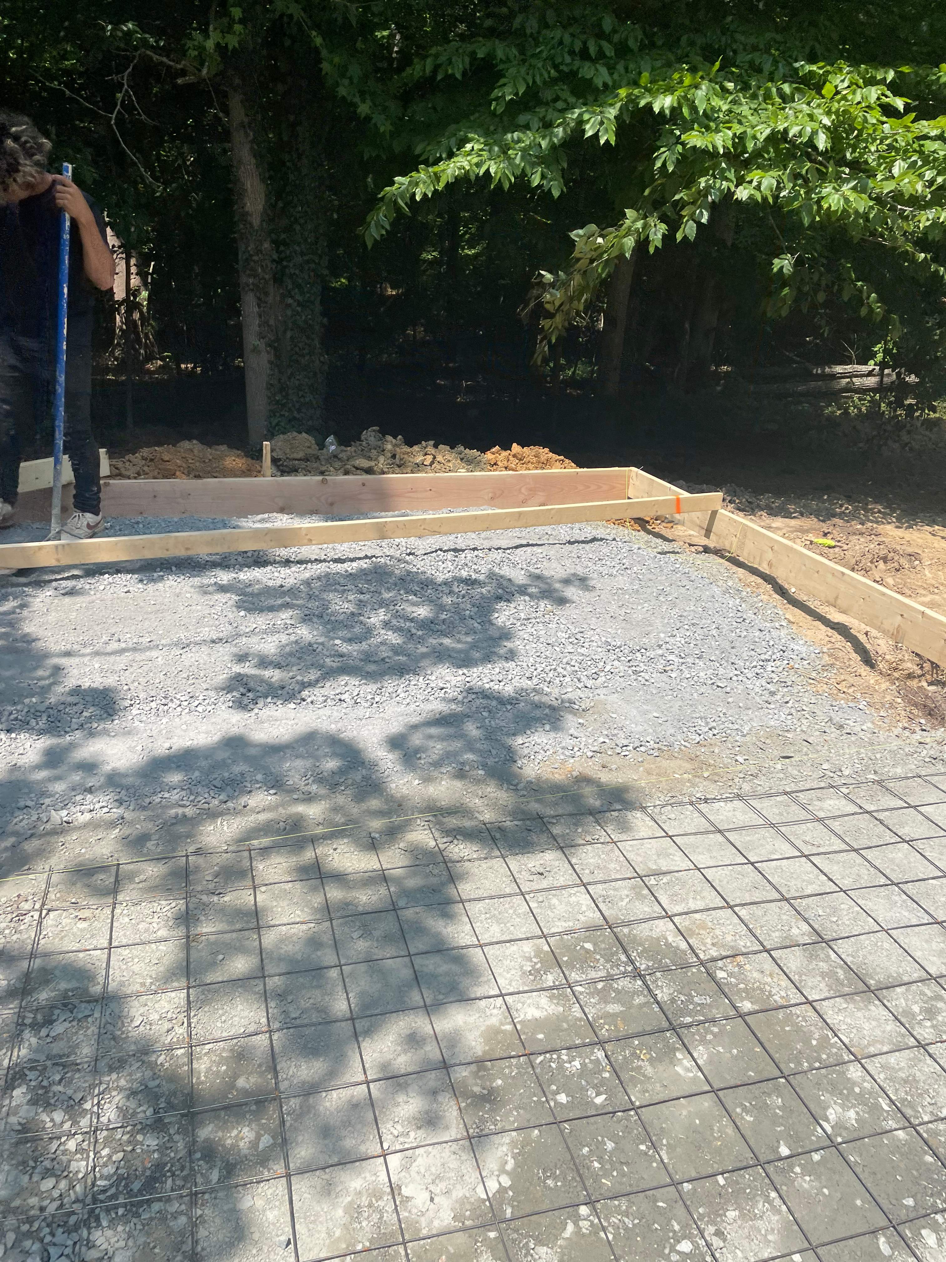 Pool Surround remodel with retaining walls, new waterfall and water slide by Fairfax Contractors, LLC