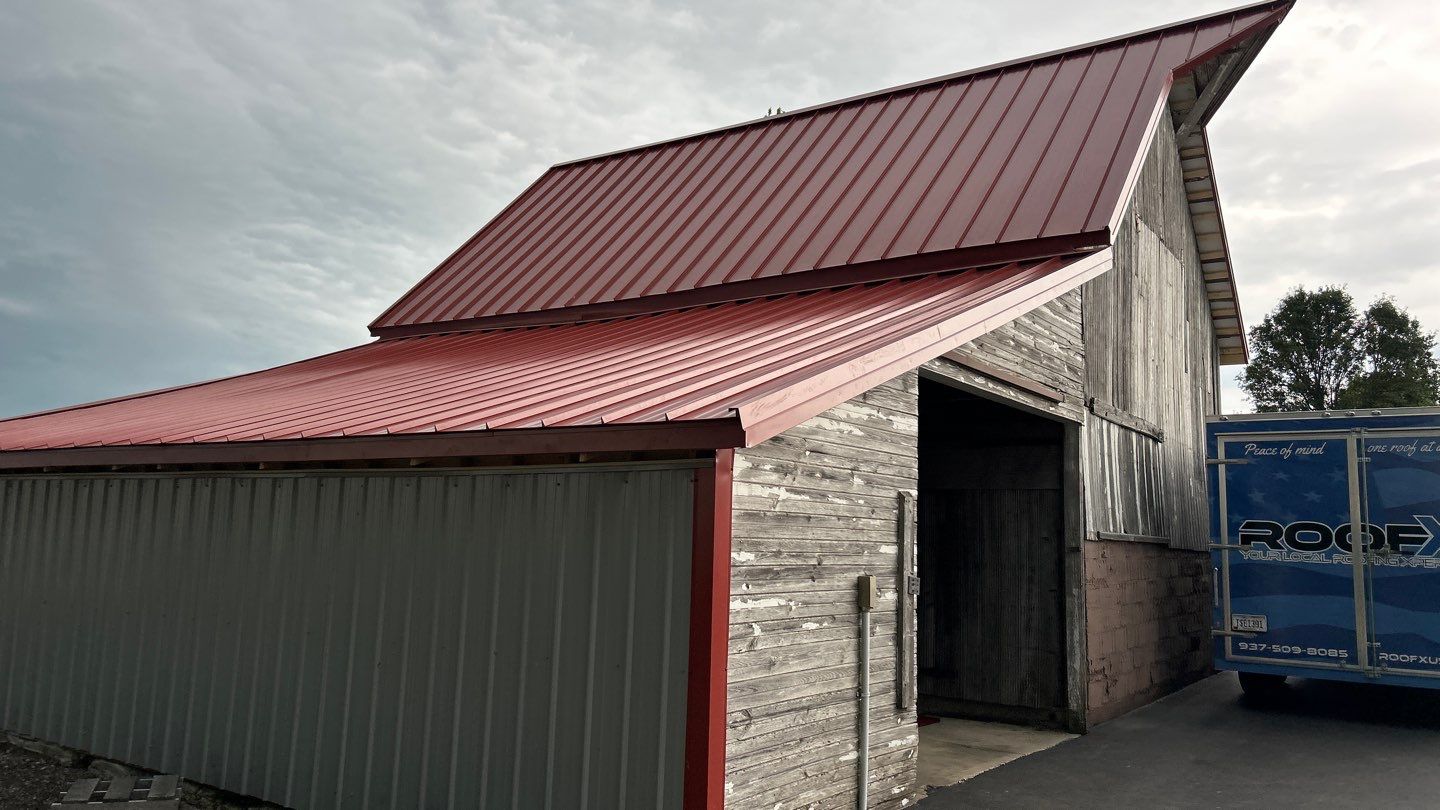 Residential Roofing Installation using Standing Seam Metal - Barn Red by RoofX 