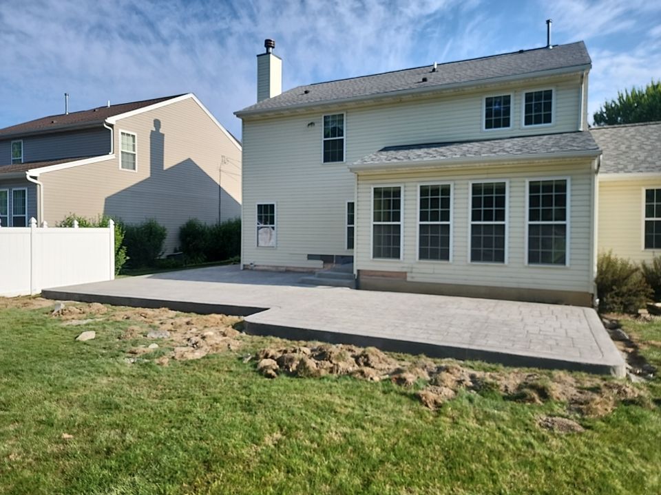 Stamped Concrete, Entry Door, and Concrete  by Ivy Lea Construction