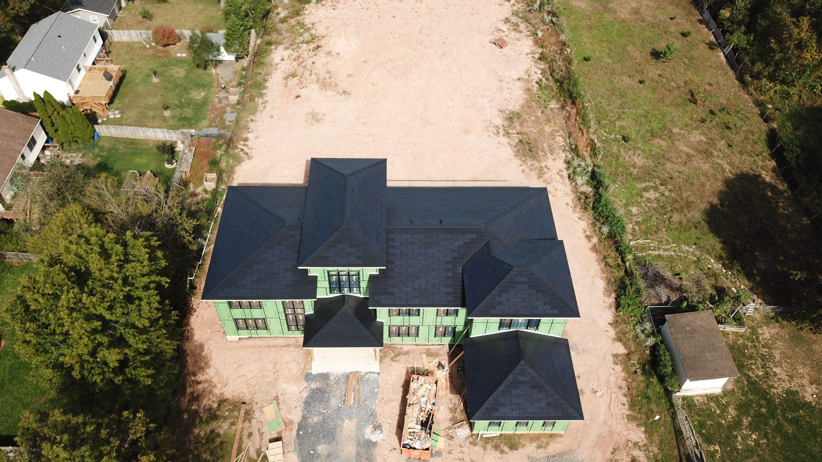 Tesla Solar Roof  using Tesla Solar Roof V3 tiles by American Home Contractors
